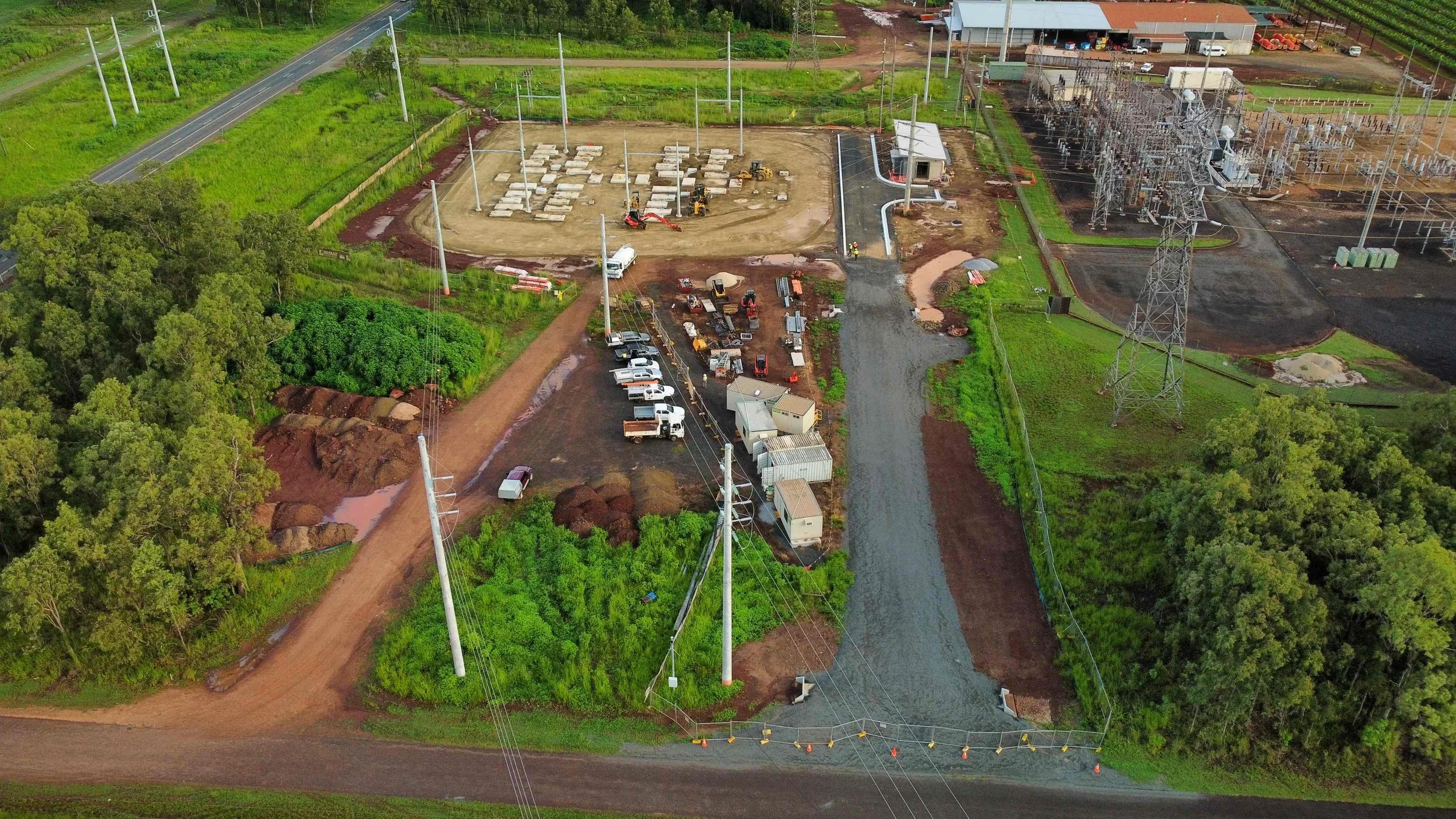 Aerial view of civil works underway at TUWE Turkinje West Substation in Mareeba, showing earthworks, concrete foundations, plant equipment and surrounding power infrastructure.