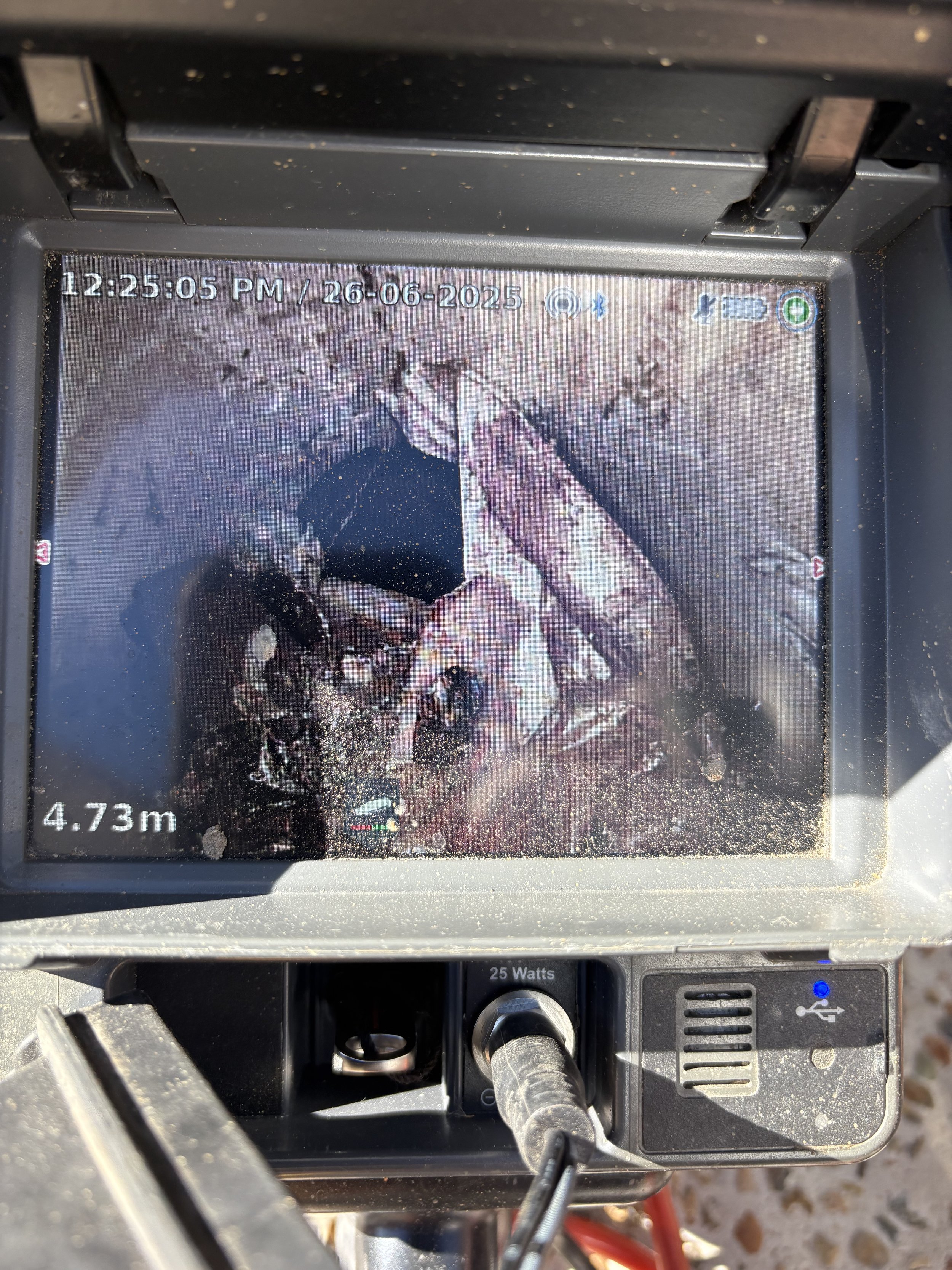 Close up of a CCTV drain inspection camera showing a blocked pipe