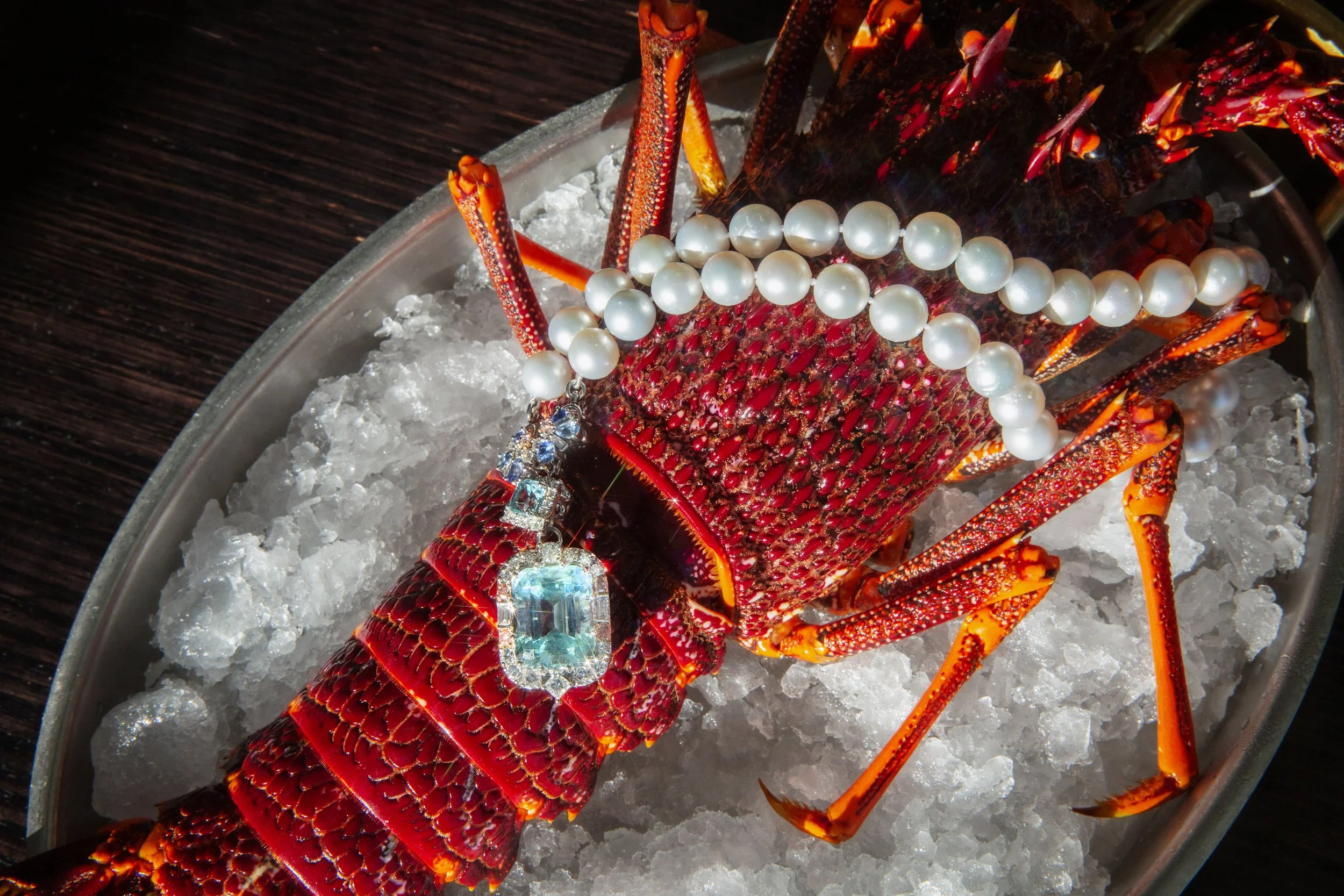 Lobster on a bed of ice decorated with pearls