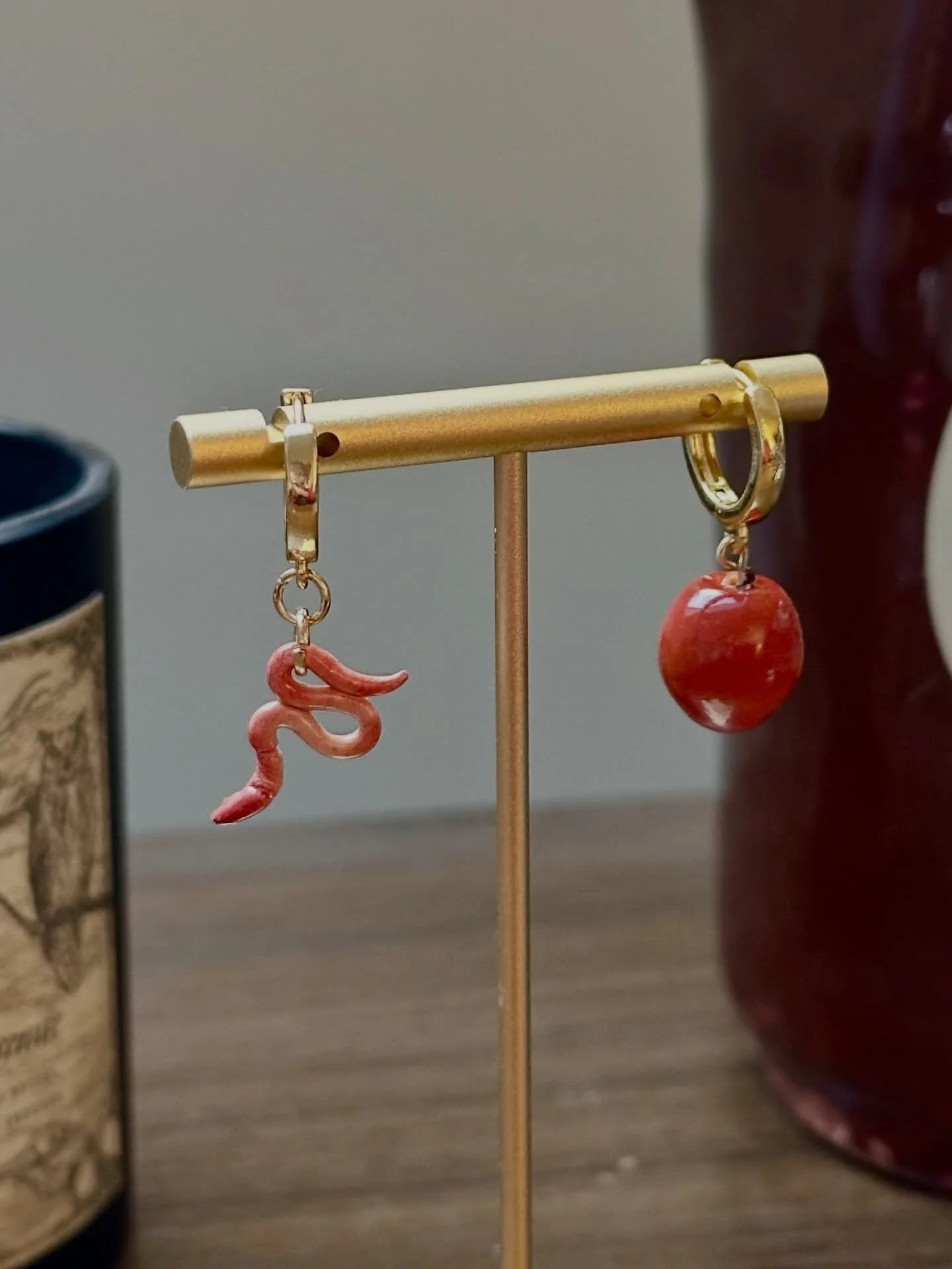 I had a dream that I made a mismatched pair of earrings, one a worm and one an apple. It inspired me to break out the polymer clay for the first time in over a year to make said earrings, and I made an extra pair as stitch markers too! I truly believ
