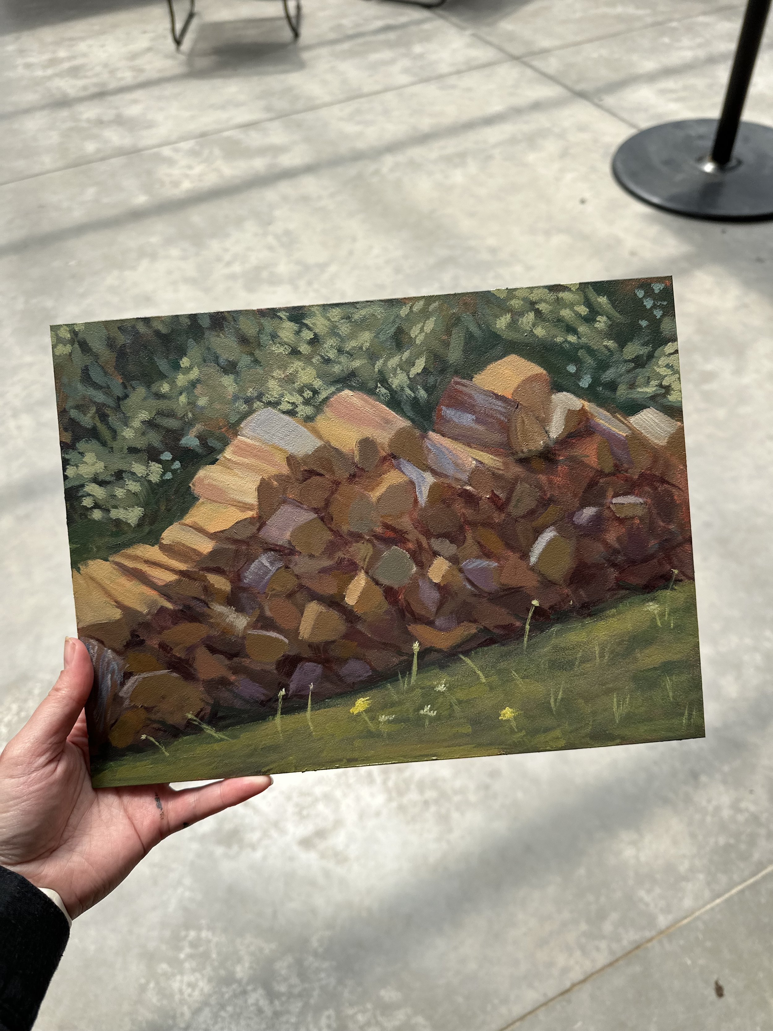 painting of a pile of chopped wood