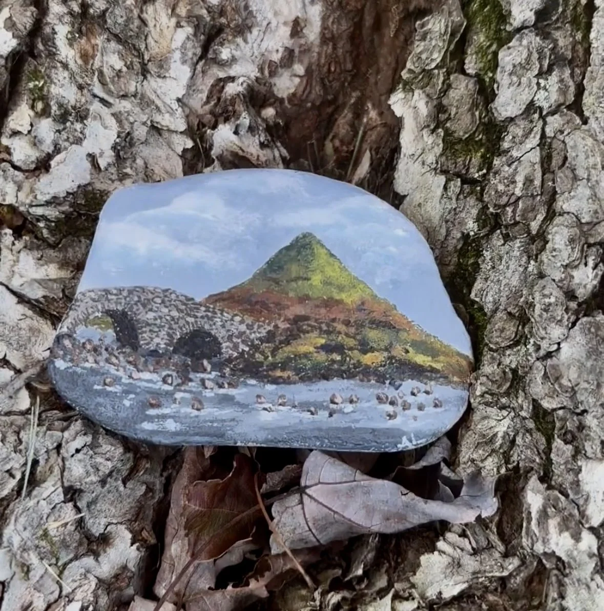 Sligachan Bridge, acrylic on natural rock, roughly 1x3", 2023