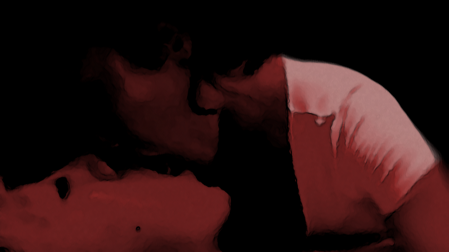 A man with curly hair and a beard kissing a woman with long dark hair, both appearing to be shirtless, in an intimate moment.
