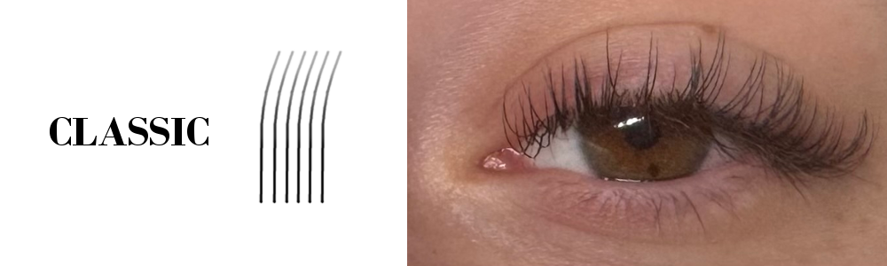 Close-up of a person's eye with brown iris and a classic set of eyelash extensions from Lashes by Rae.