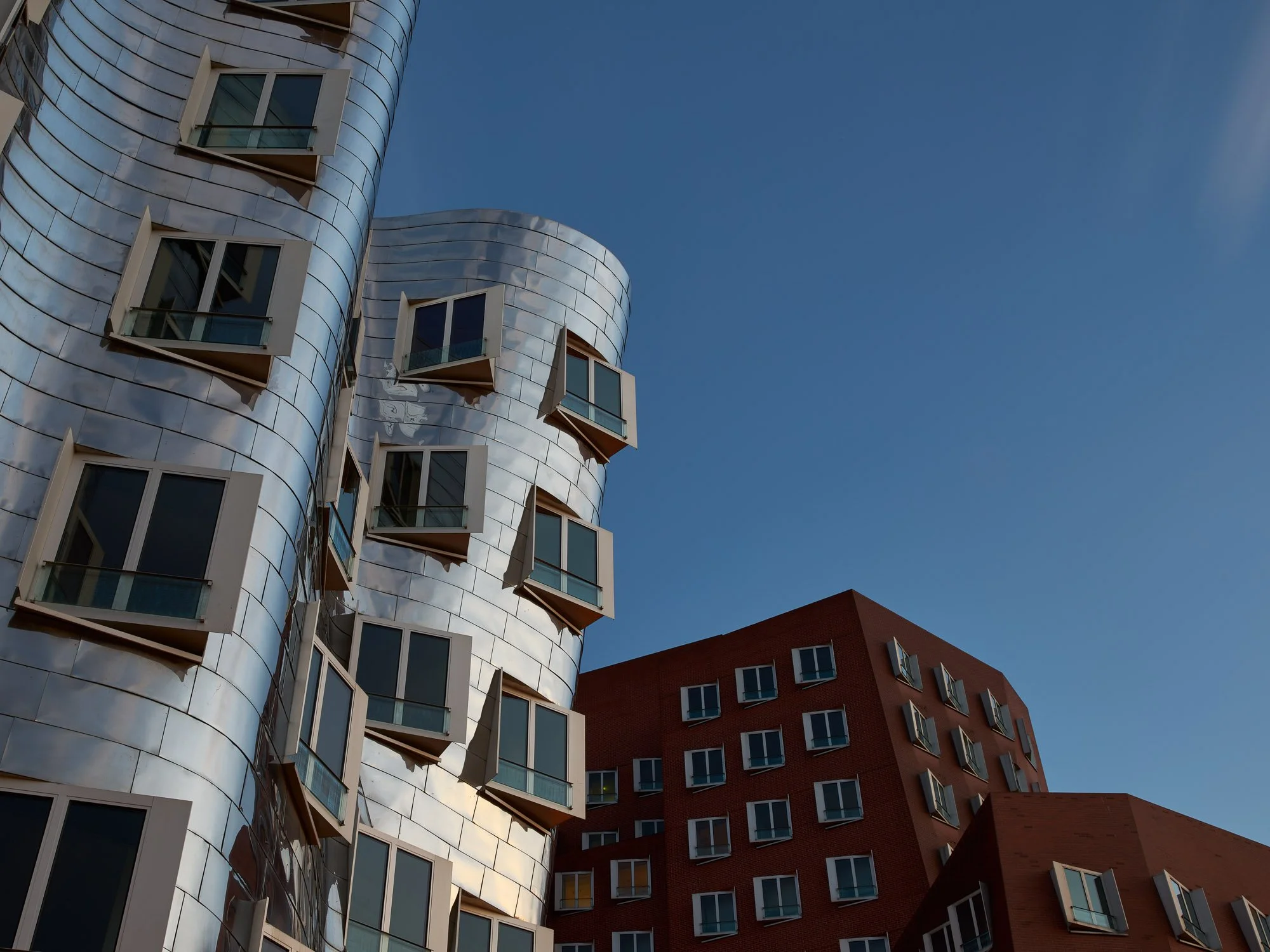 Two of the contrasting Neuer Zollhof buildings by Frank Gehry in Dusseldorf, Germany