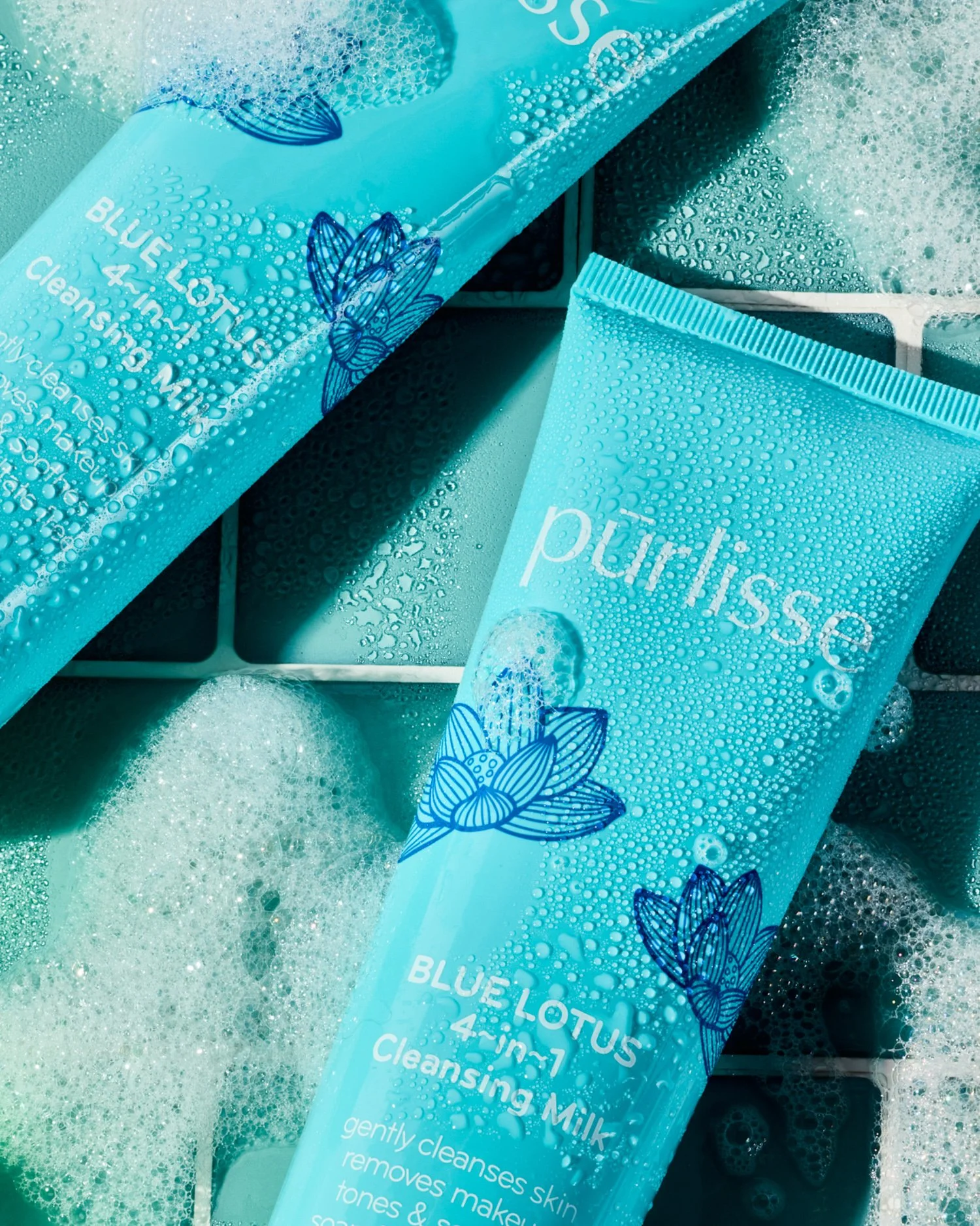 Blue Lotus cleansing milk product shot with bubbles for skincare campaign
