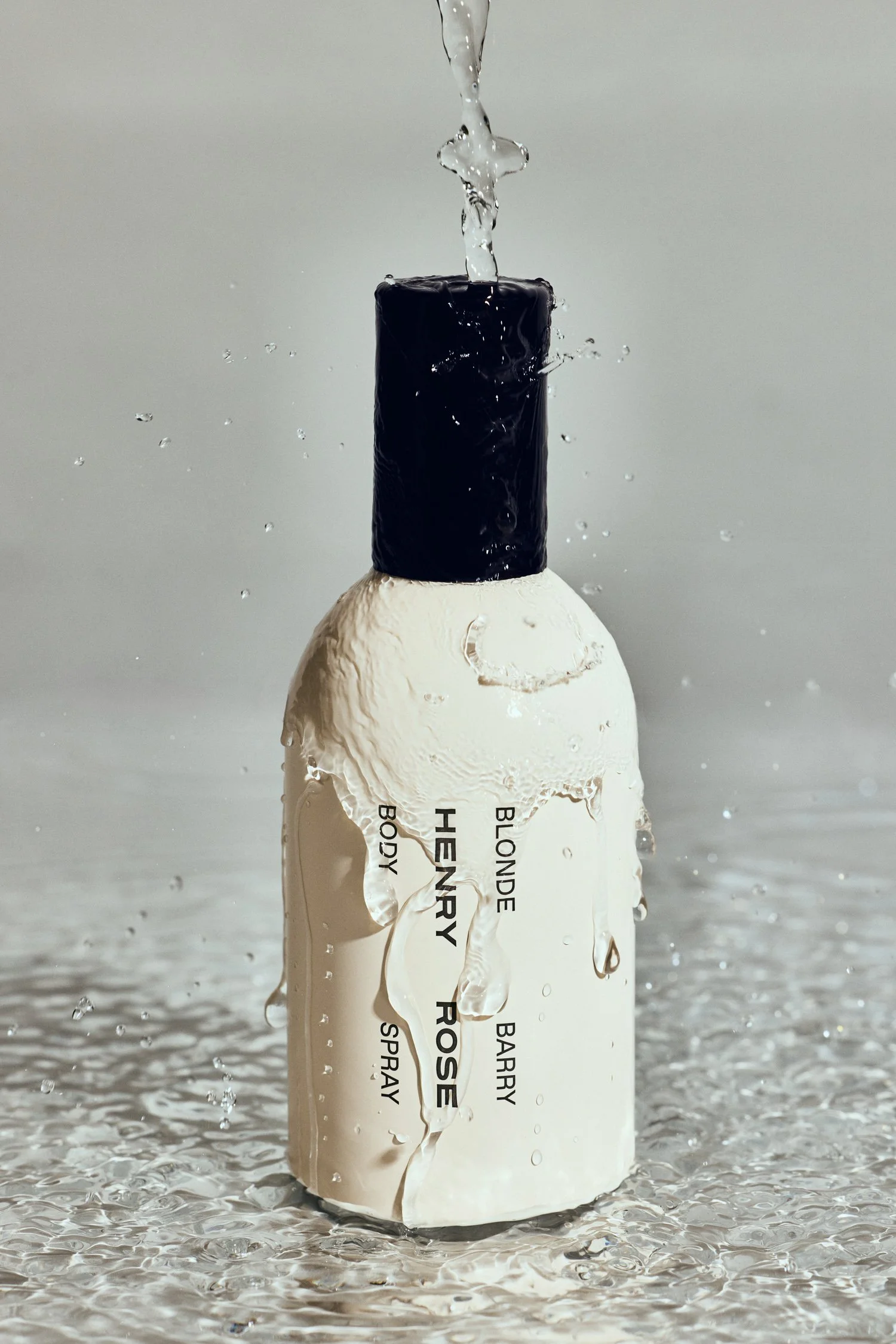 Splash shot of Henry Rose perfume bottle — creative beauty brand content