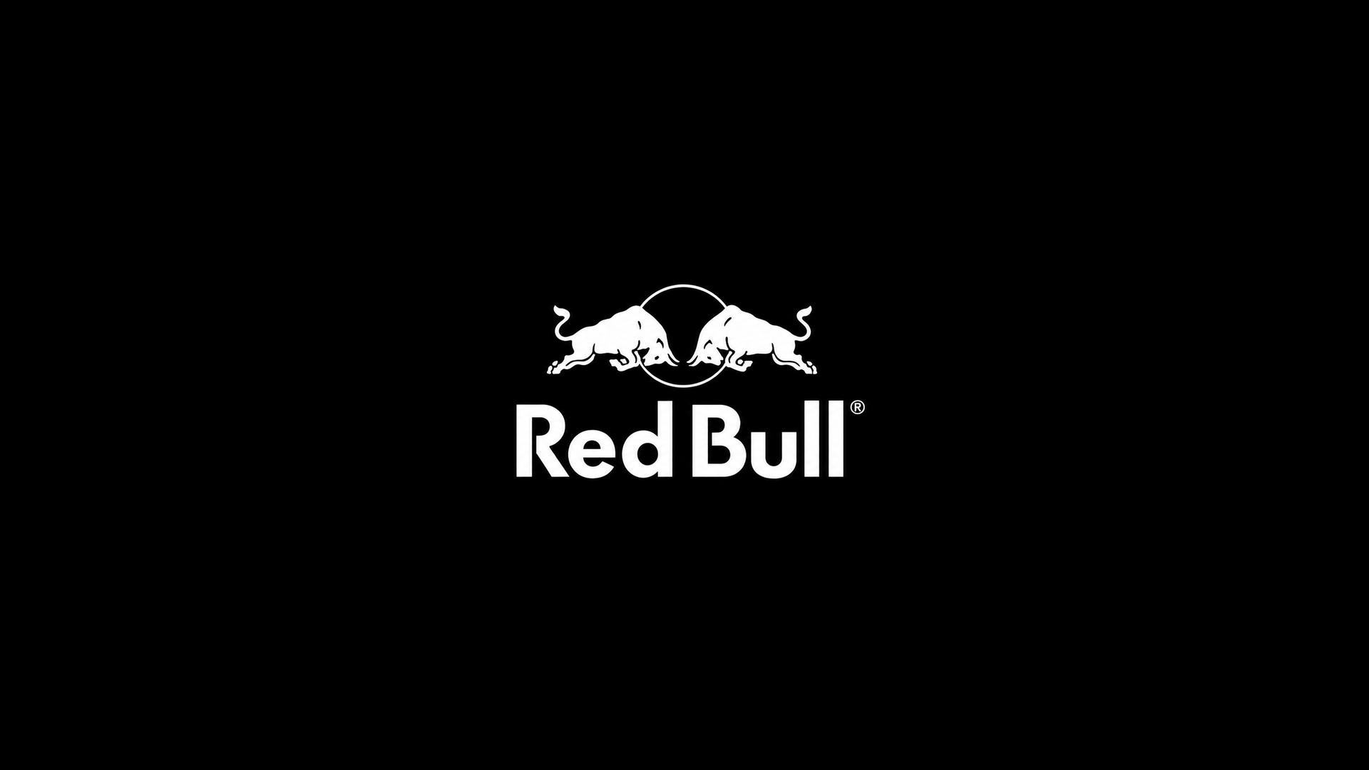 Black background with the white Red Bull logo featuring two bulls charging at each other above the words 'Red Bull'.
