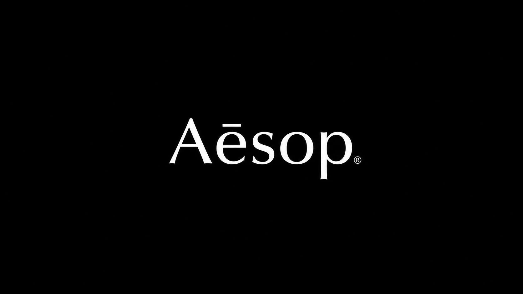 Black background with the word 'Aēsop' in white, serif font centered in the image.