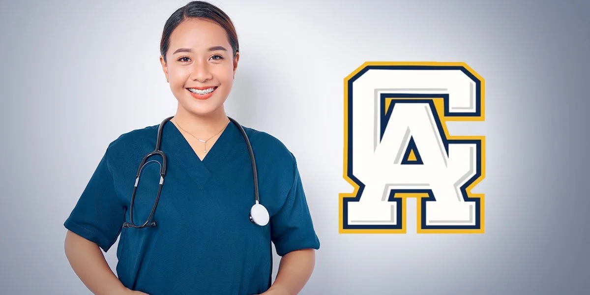 A smiling woman in blue medical scrubs with a stethoscope around her neck, standing next to a white and gold university logo on a gray background.