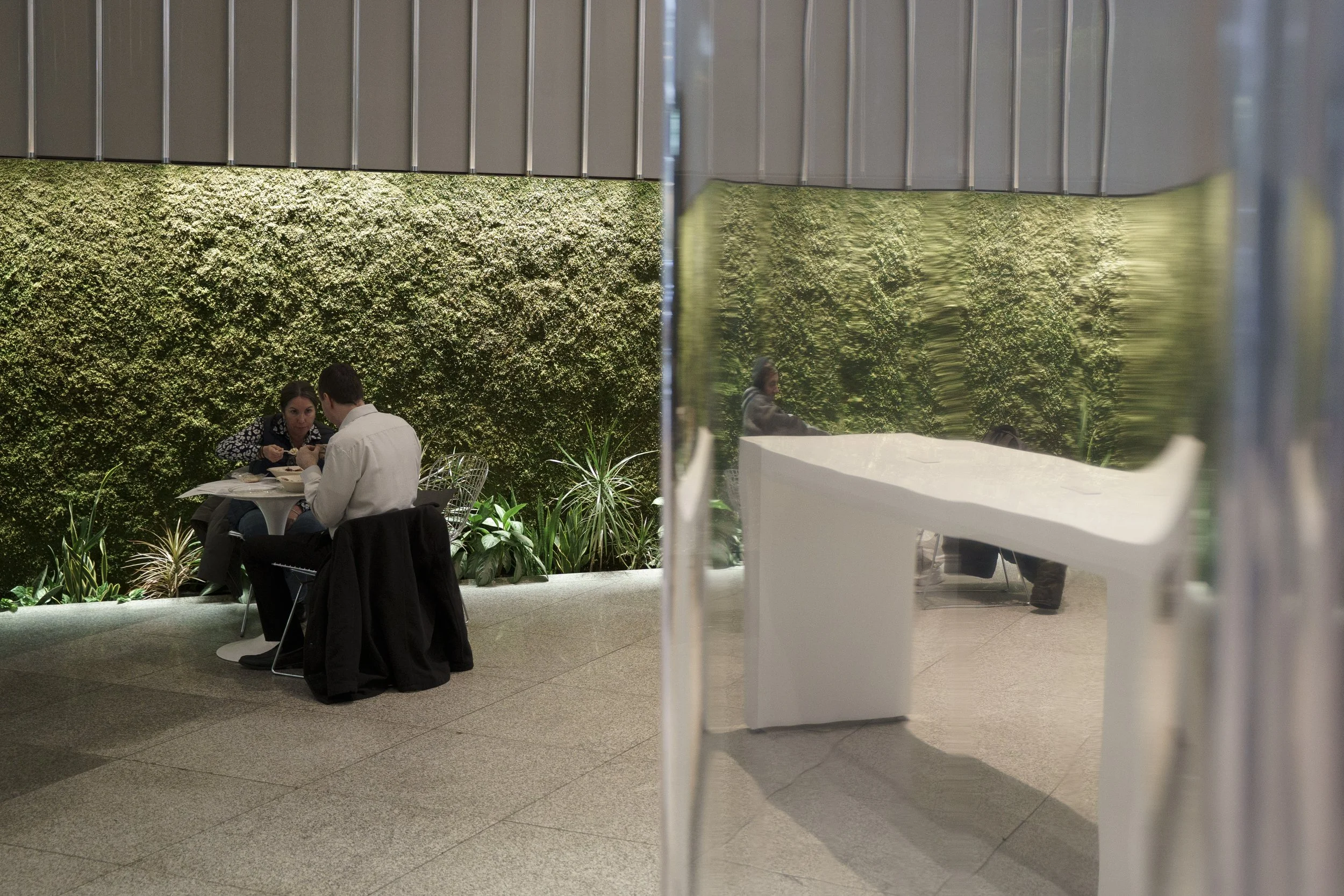 A moss wall backdrop to the lobby of an investment banking company in Midtown. 