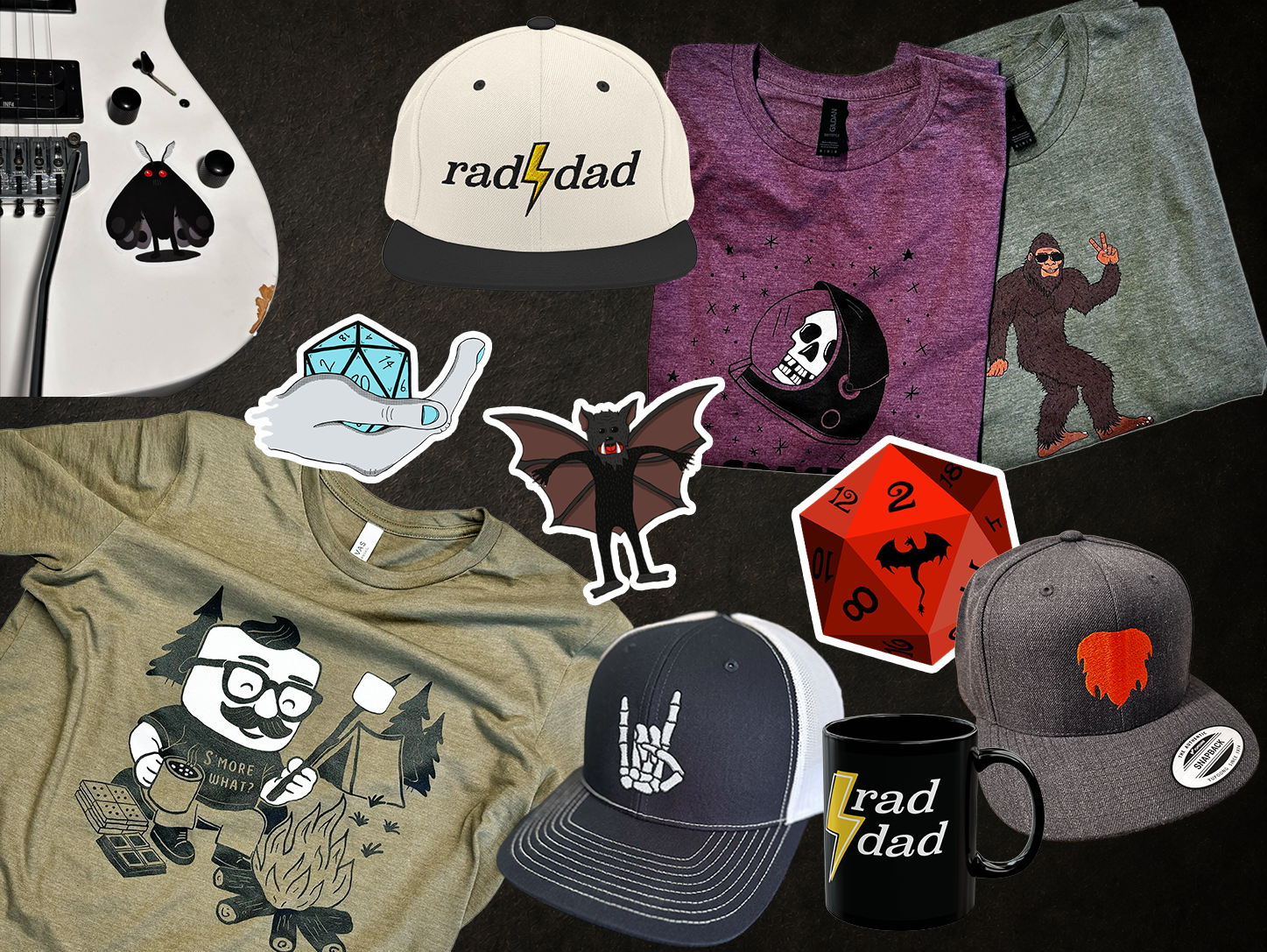 A collection of novelty items, including themed t-shirts, hats, and stickers with designs of skulls, bats, a gorilla, a skeleton hand, a dice, and a humorous cartoon character. There is also a mug with the word "rad" and a lightning bolt, and a turntable.