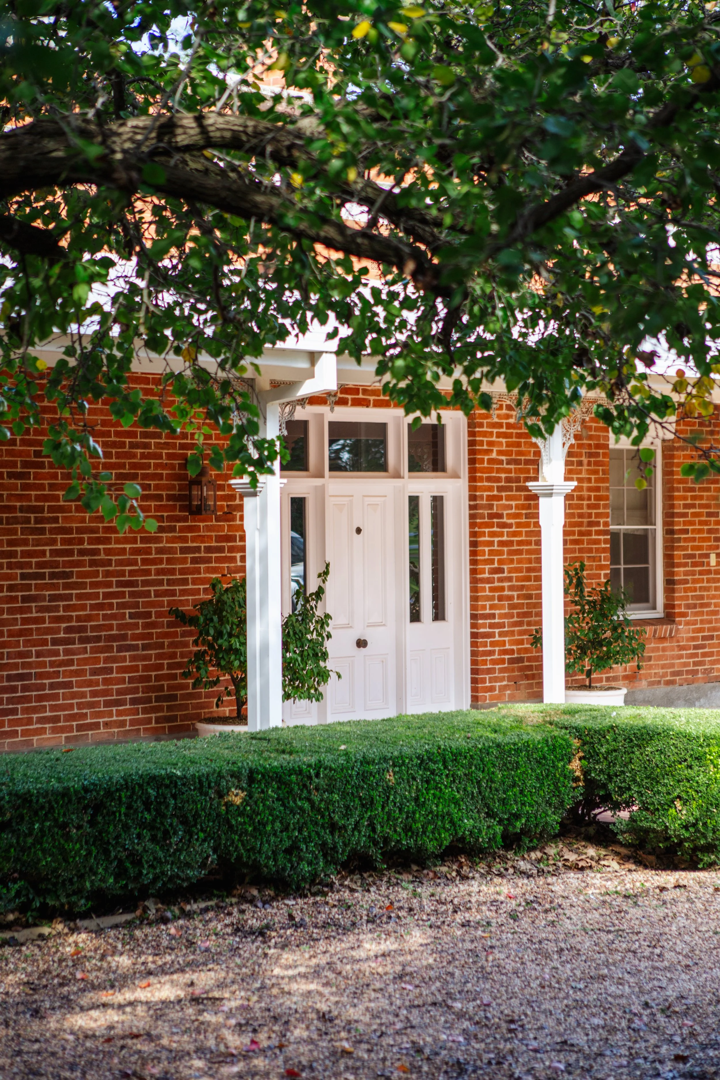 view of front door on bective station homestead with manicured gardens