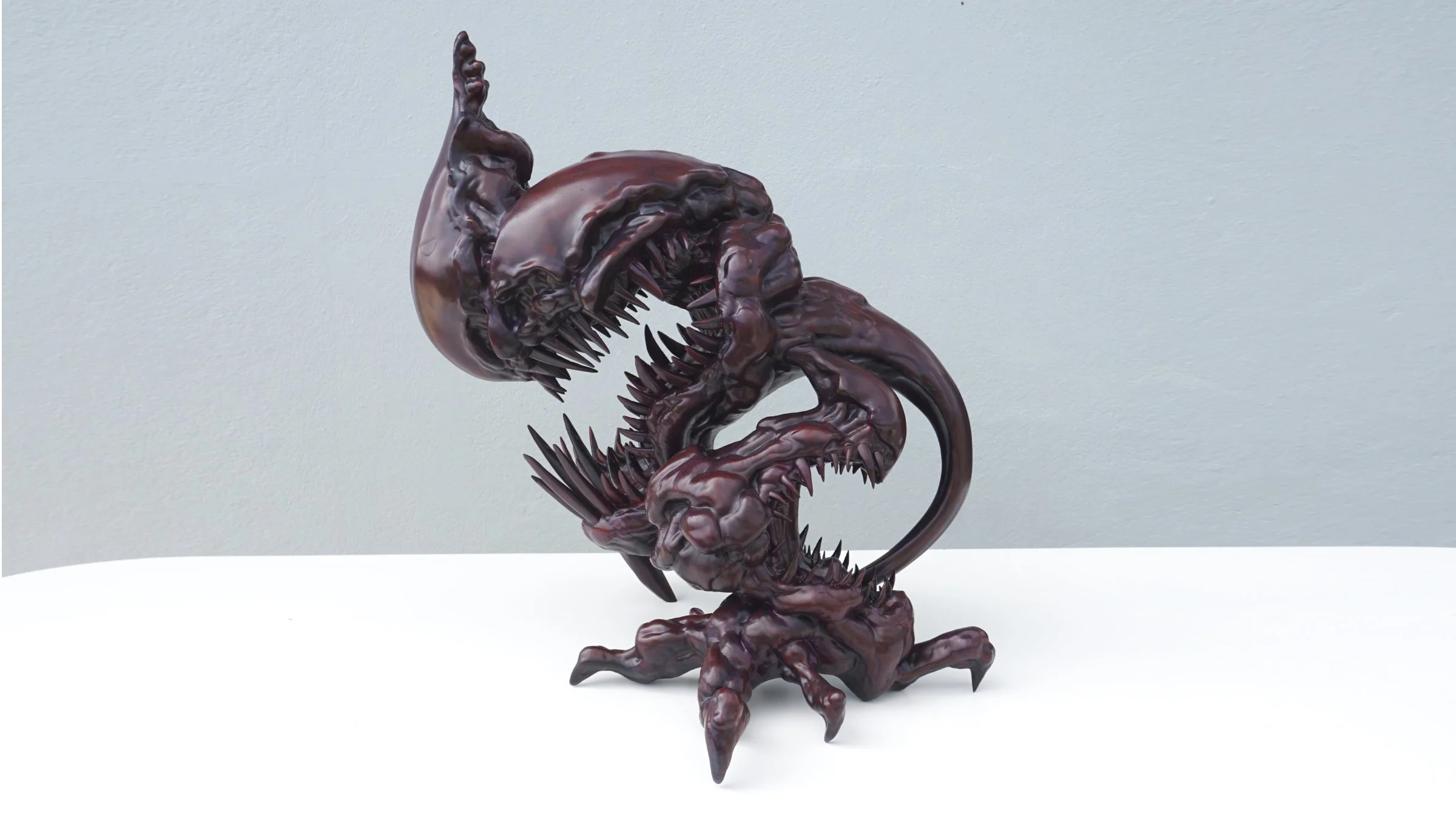 Side view of TOSA-MARA contemporary sculpture, depicting the internal struggle and suppressed emotions through creature design.