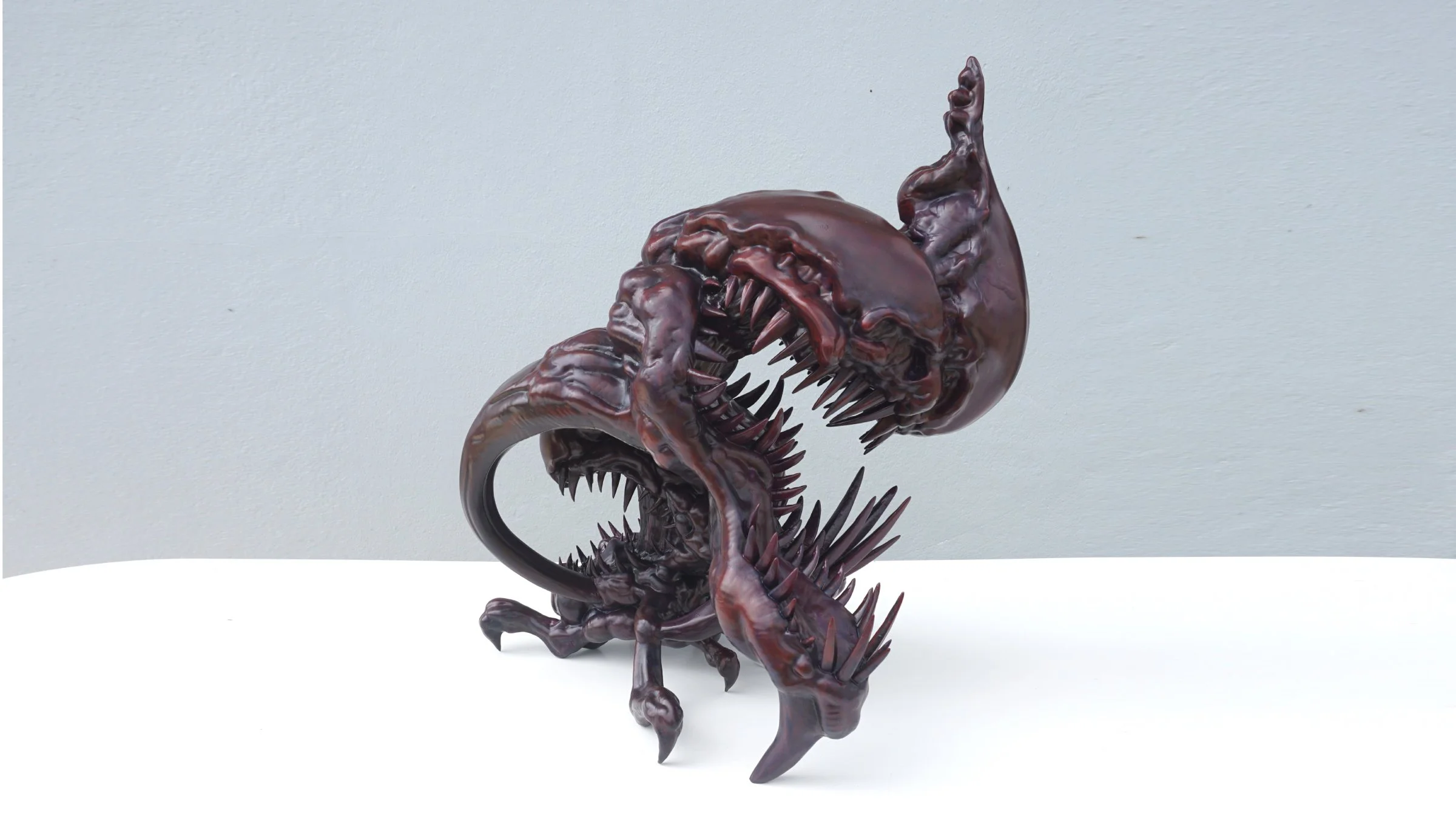 Perspective view of TOSA-MARA contemporary sculpture, depicting the internal struggle and suppressed emotions through creature design.