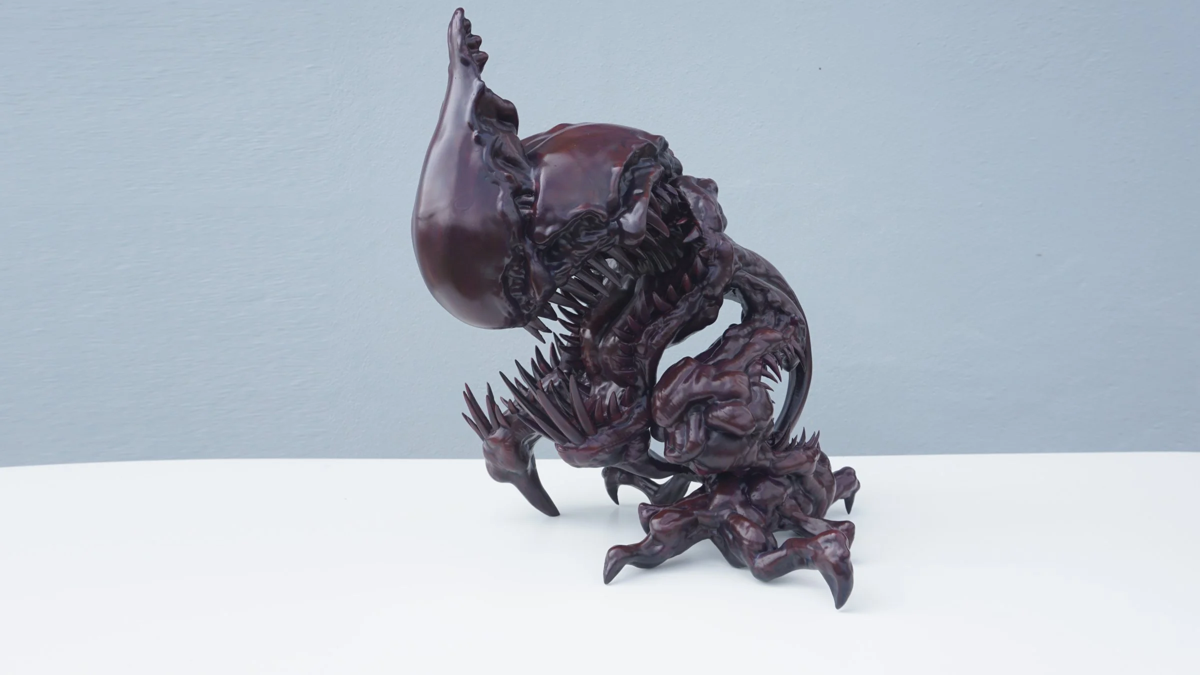 Perspective view of TOSA-MARA contemporary sculpture, depicting the internal struggle and suppressed emotions through creature design.