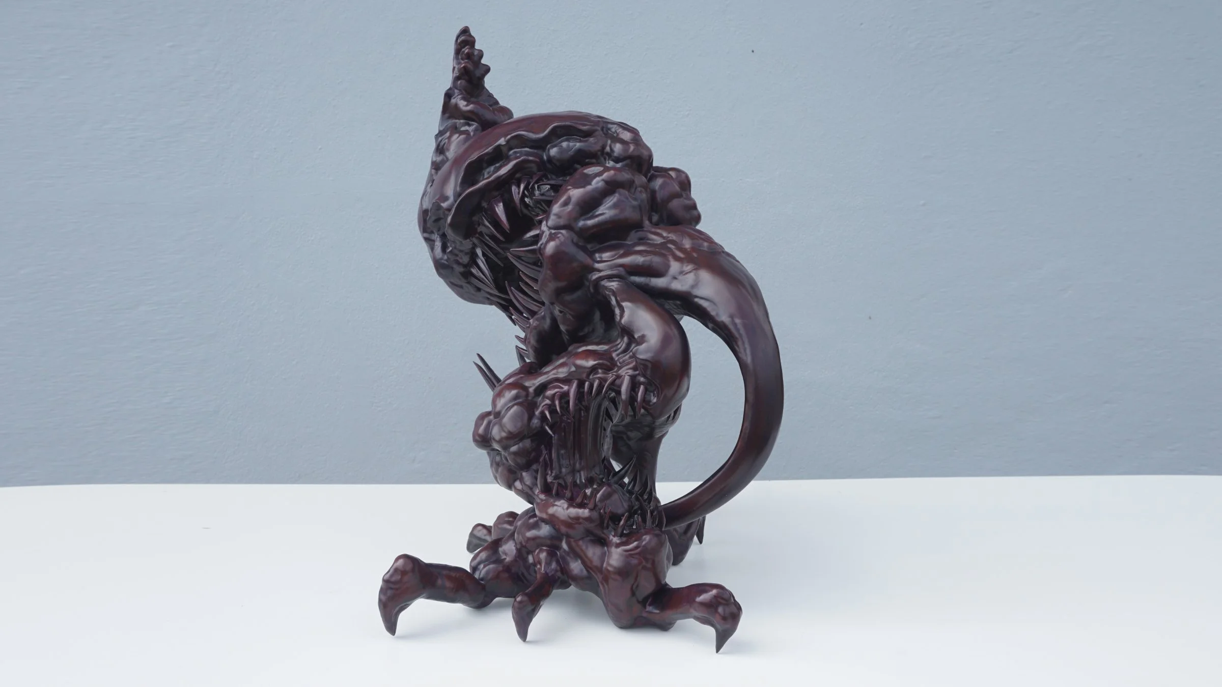 Back view of TOSA-MARA contemporary sculpture, depicting the internal struggle and suppressed emotions through creature design.