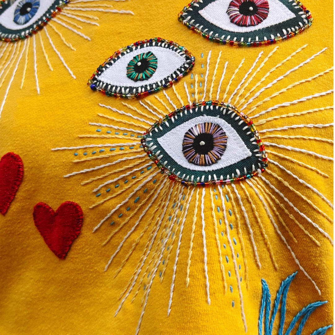 Upcycled-sweatshirt-embroidery-applique-handmade-heart-birds-beaded-eye.jpg