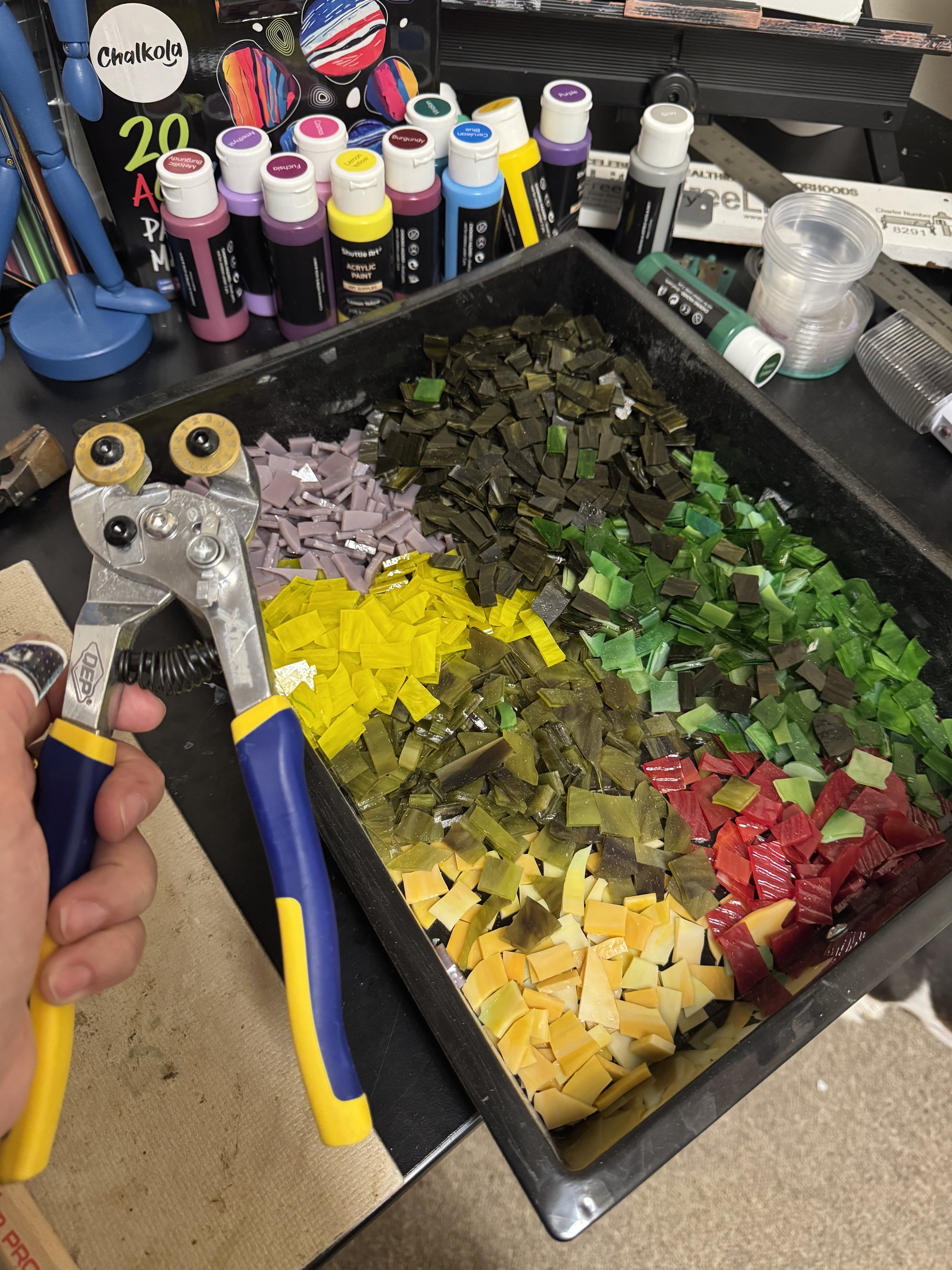 Cutting glass for the mosaic on the door.