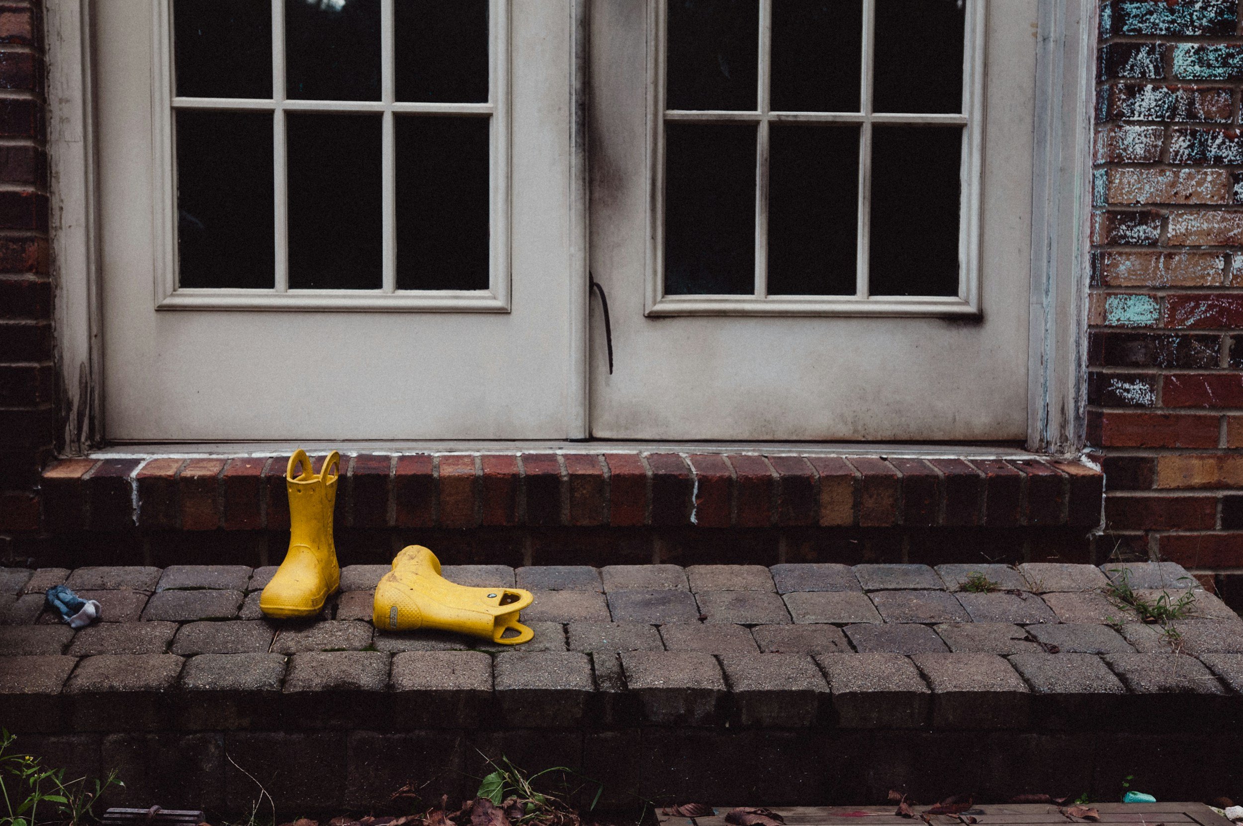 Dirty gumboots outside the door, showing how Candela Architecture design for local living in Central Otago and Southland