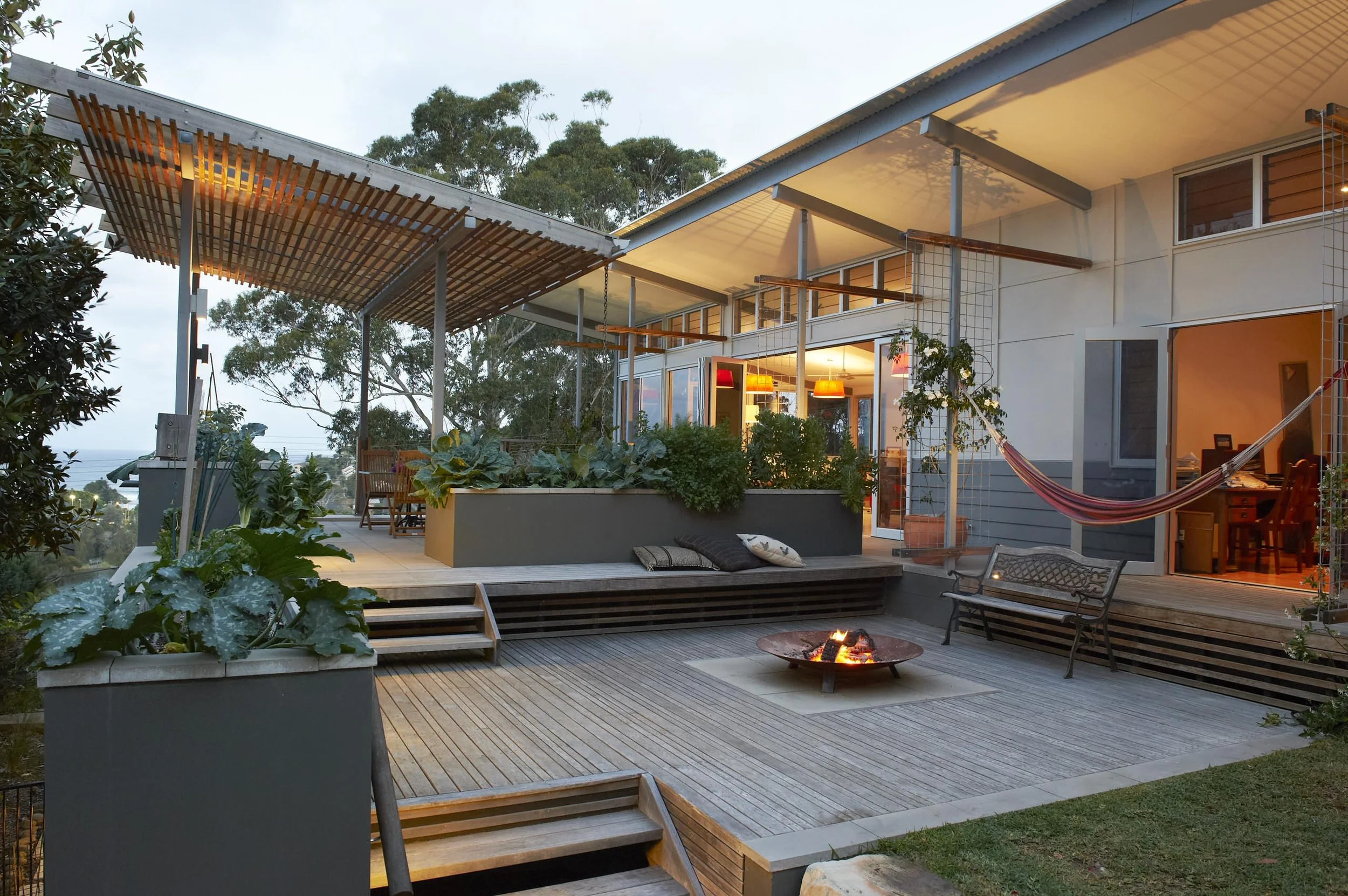 A private outdoor living area, while allowing views and extended comfort into the fringe seasons by Candela Architecture