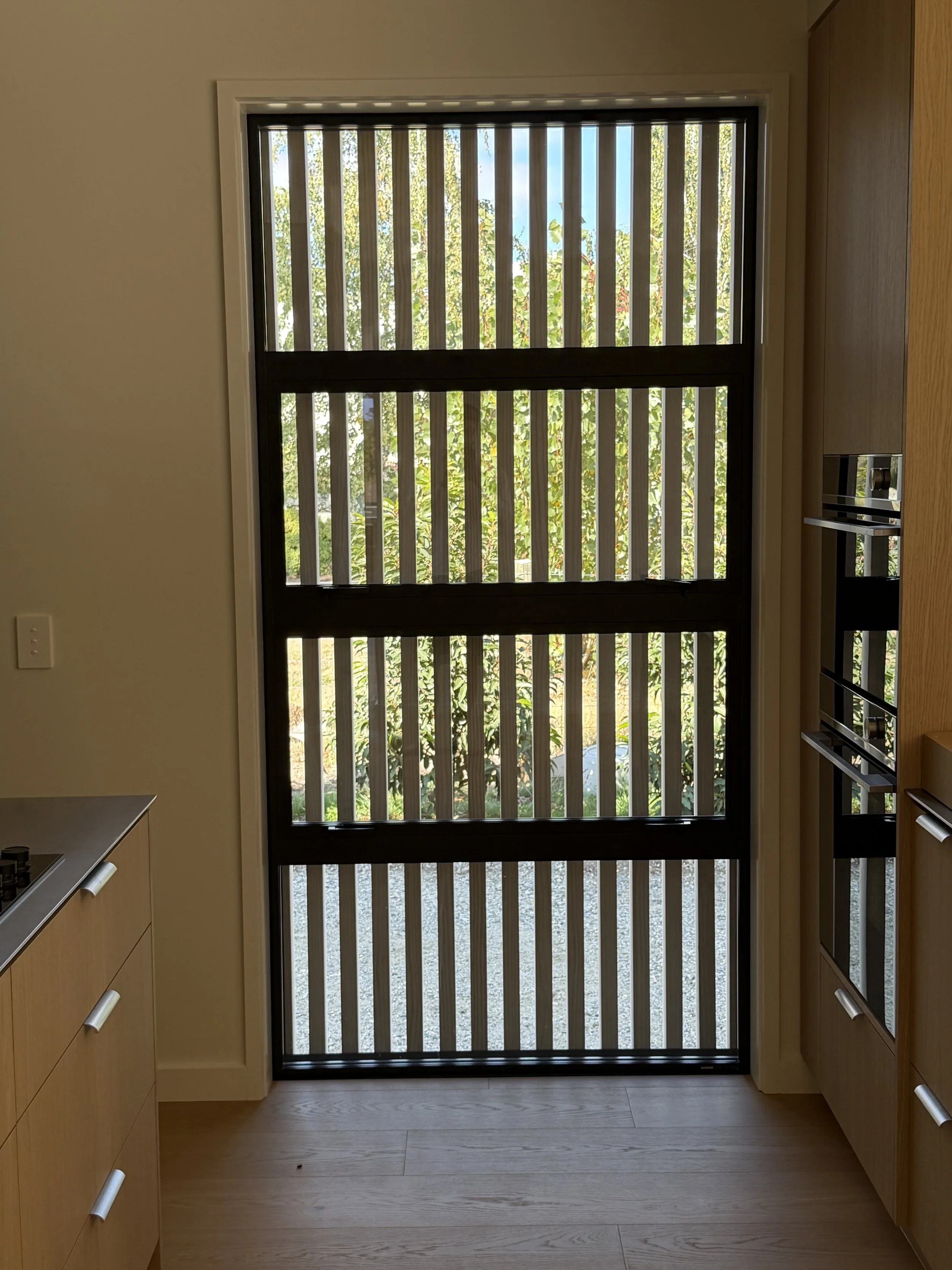 Privacy screening on the exterior of this Alexandra Home. . Designed by the team at Candela Architecture working across Queenstown, Wanaka, Cromwell, Alexandra, and Invercargill.