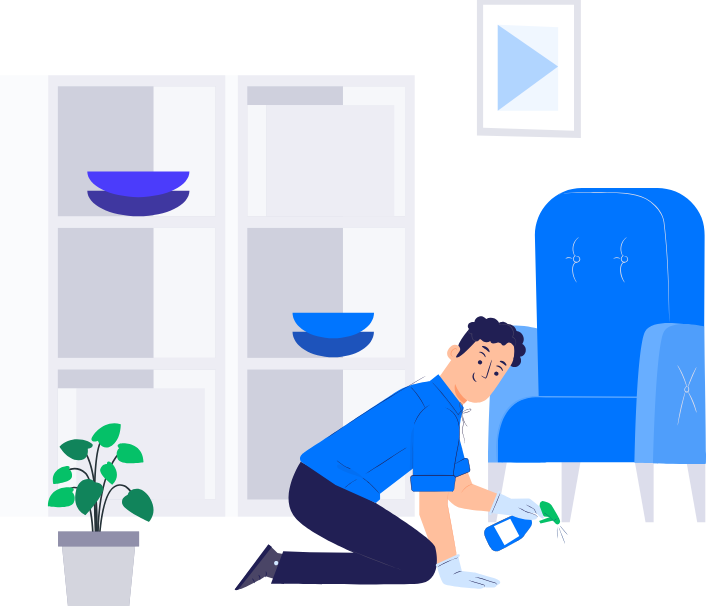 Person cleaning a blue armchair with a spray bottle in a modern living room with bookshelf and potted plant.