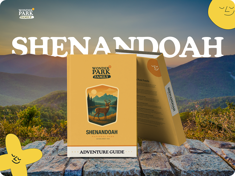 Shenandoah National Park Adventure Guide booklet from Wonder Park Family, placed on rocks, with a scenic mountain view in the background and the word 'SHENANDOAH' prominently displayed at the top.