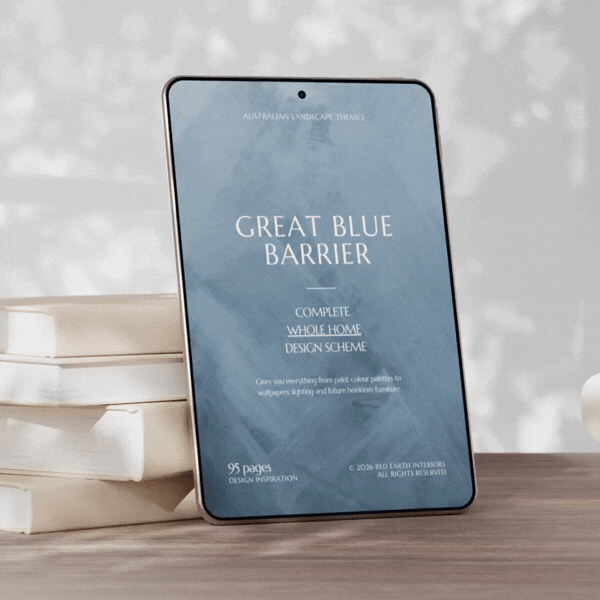 Tablet displaying a book cover titled 'Great Blue Barrier' with an abstract blue background, placed on a wooden surface next to a stack of white books.