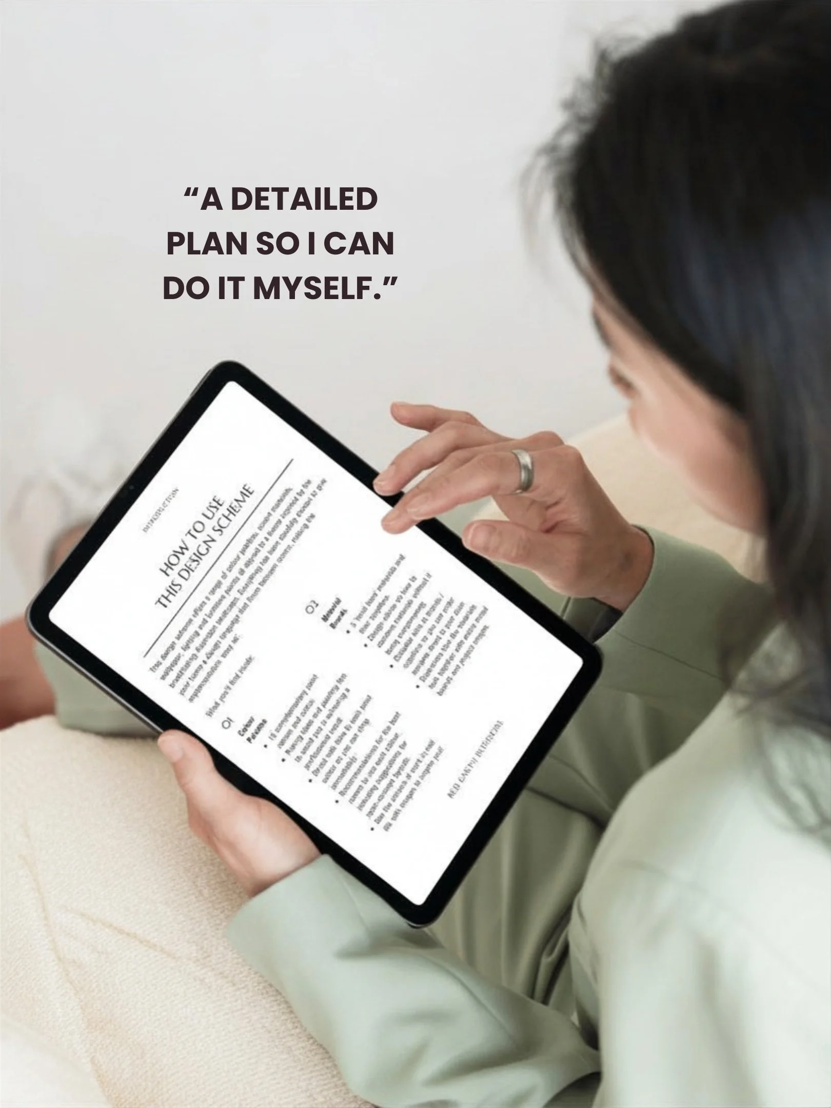 A woman with dark hair looking at a tablet that displays a document on a white background. The document includes a heading 'HOW TO USE THIS DESIGN SCHEME' and detailed instructions. In the background, there is a quote on the wall that says, 'A DETAILED PLAN SO I CAN DO IT MYSELF.'