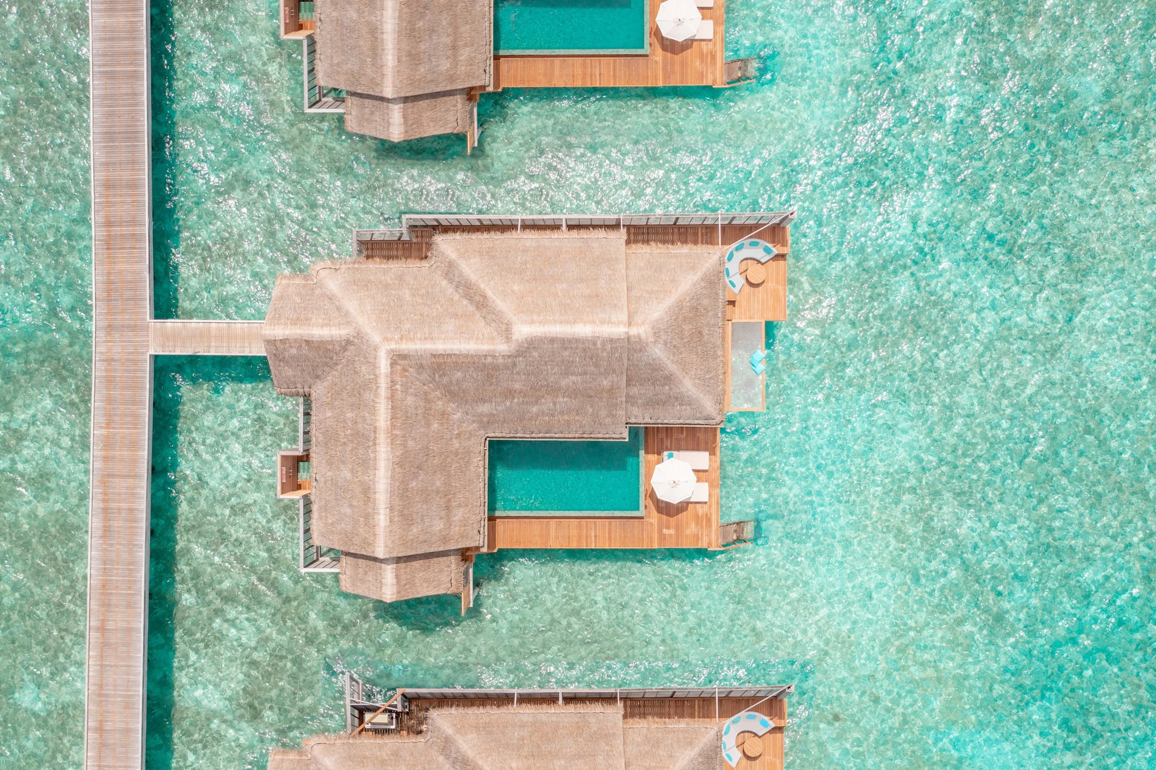 Anantara Kihavah - Aerial Over Water Pool Villas Portrait-232.jpg