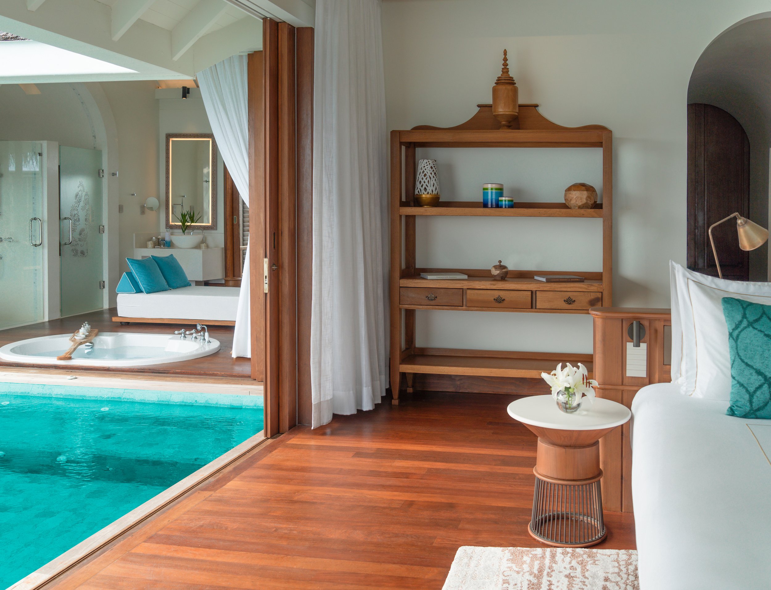 Anantara Kihavah - Over Water Pool Villa Bedroom with Pool and Bathroo.jpg