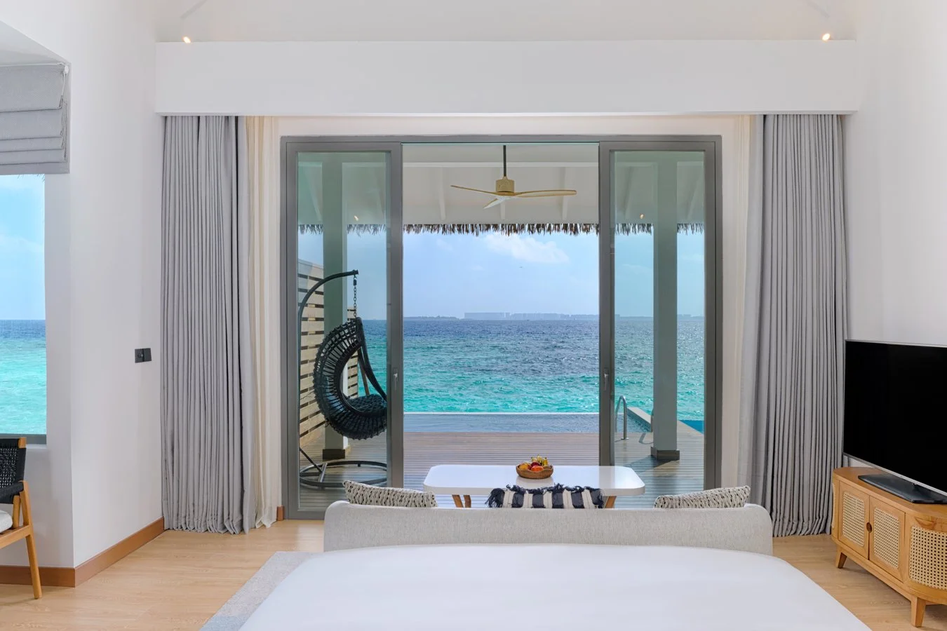dusitd2-feydhoo-maldives-accommodation-overwater-pool-villa-bedroom-view-1350x900.jpg