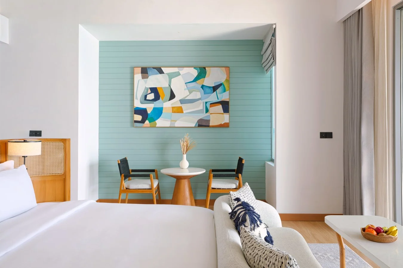 dusitd2-feydhoo-maldives-accommodation-overwater-pool-villa-bedroom-seating-area-1350x900.jpg