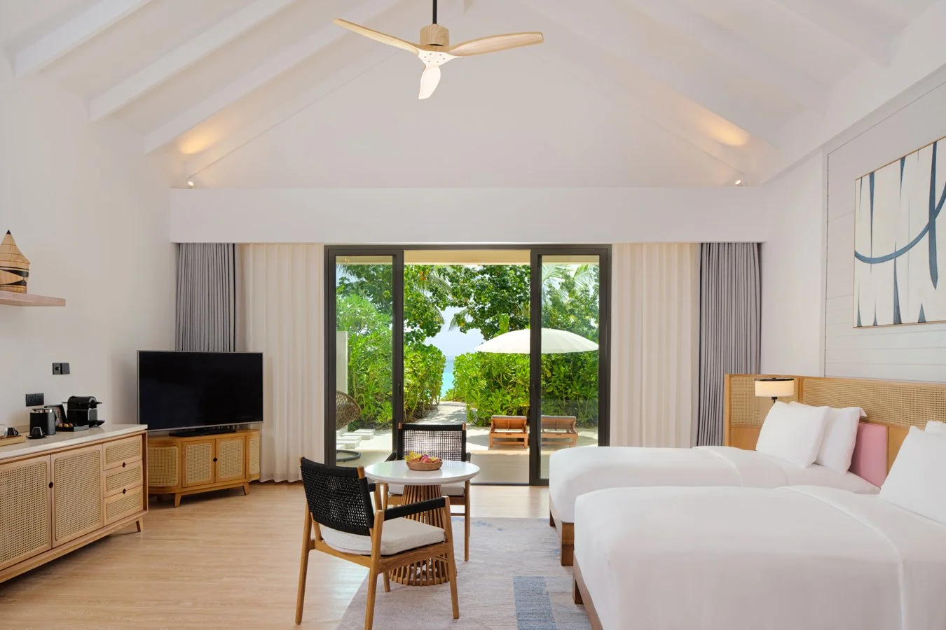 dusitd2-feydhoo-maldives-accommodation-beach-bedroom-twin-beds-lounge-1350x900.jpg