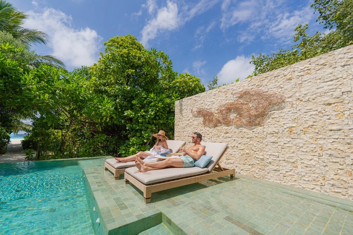 Anantara Kihavah - Beah Pool Villa - Couple in Pool-1200x800.jpg