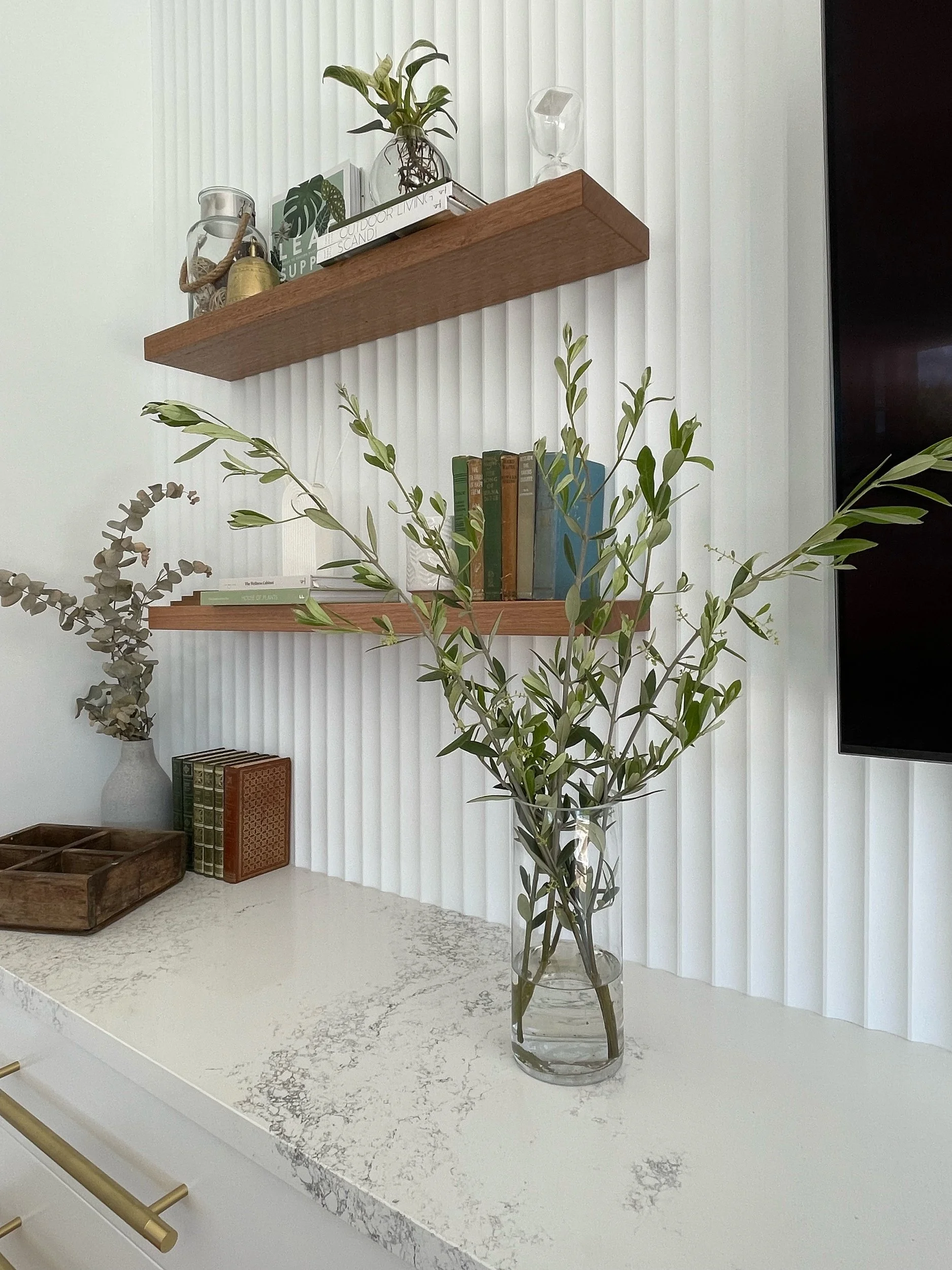Saxon Lounge

Wall cladding - Laminex Surround
Paint - Vivid white
Cabinetry - Flat panel - 2PAC vivid white
Stone - Caeserston 'Empire white'
Handles - Lo and Co
Shelves - South Oak woodcraft