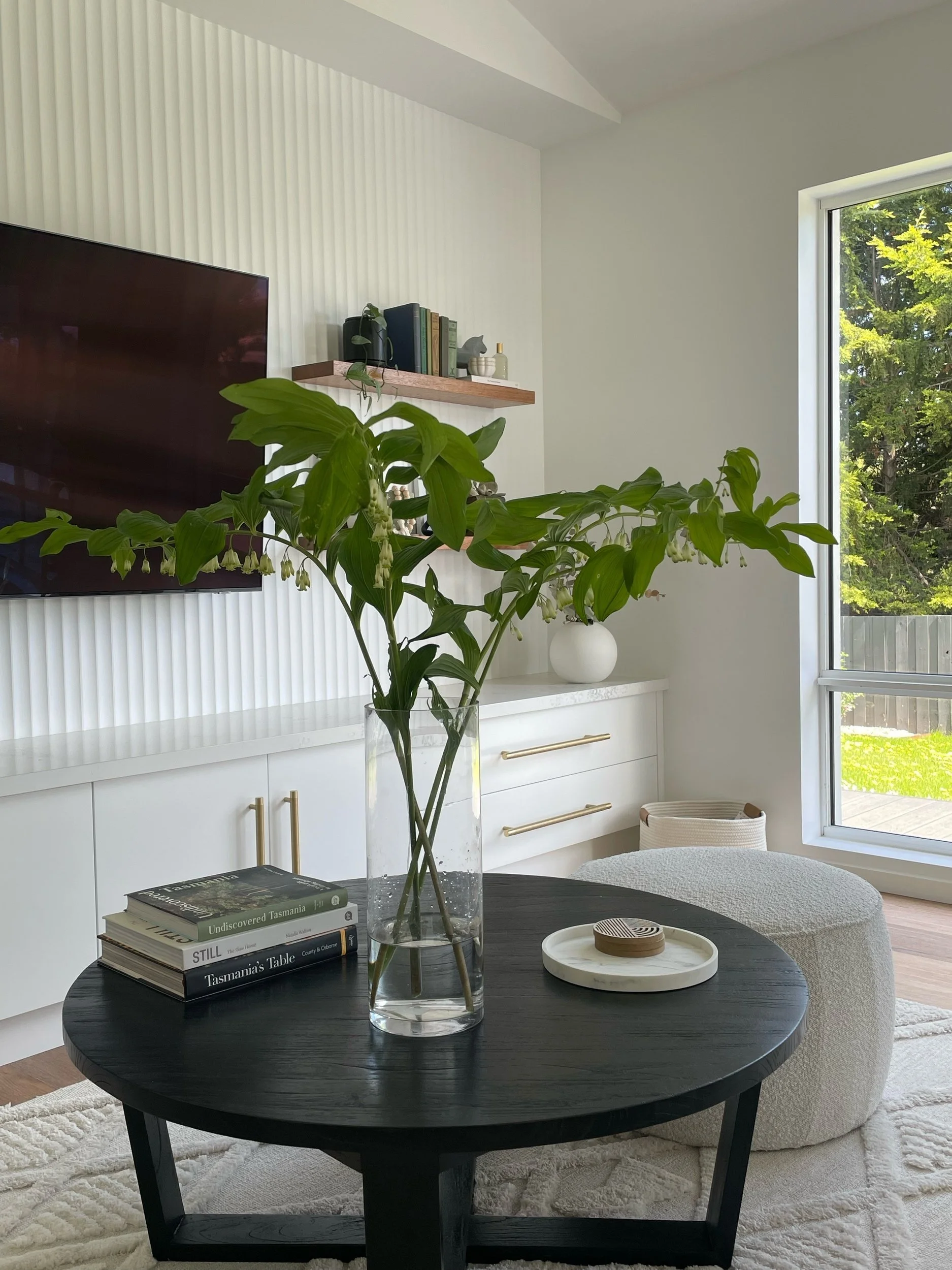 Saxon Lounge

Wall cladding - Laminex Surround
Paint - Vivid white
Cabinetry - Flat panel - 2PAC vivid white
Handles - Lo and Co
Floor - Karndean Korlock 'warm ash'
Rug - Miss Amara
Shelves - South Oak woodcraft
Table - Living by design

