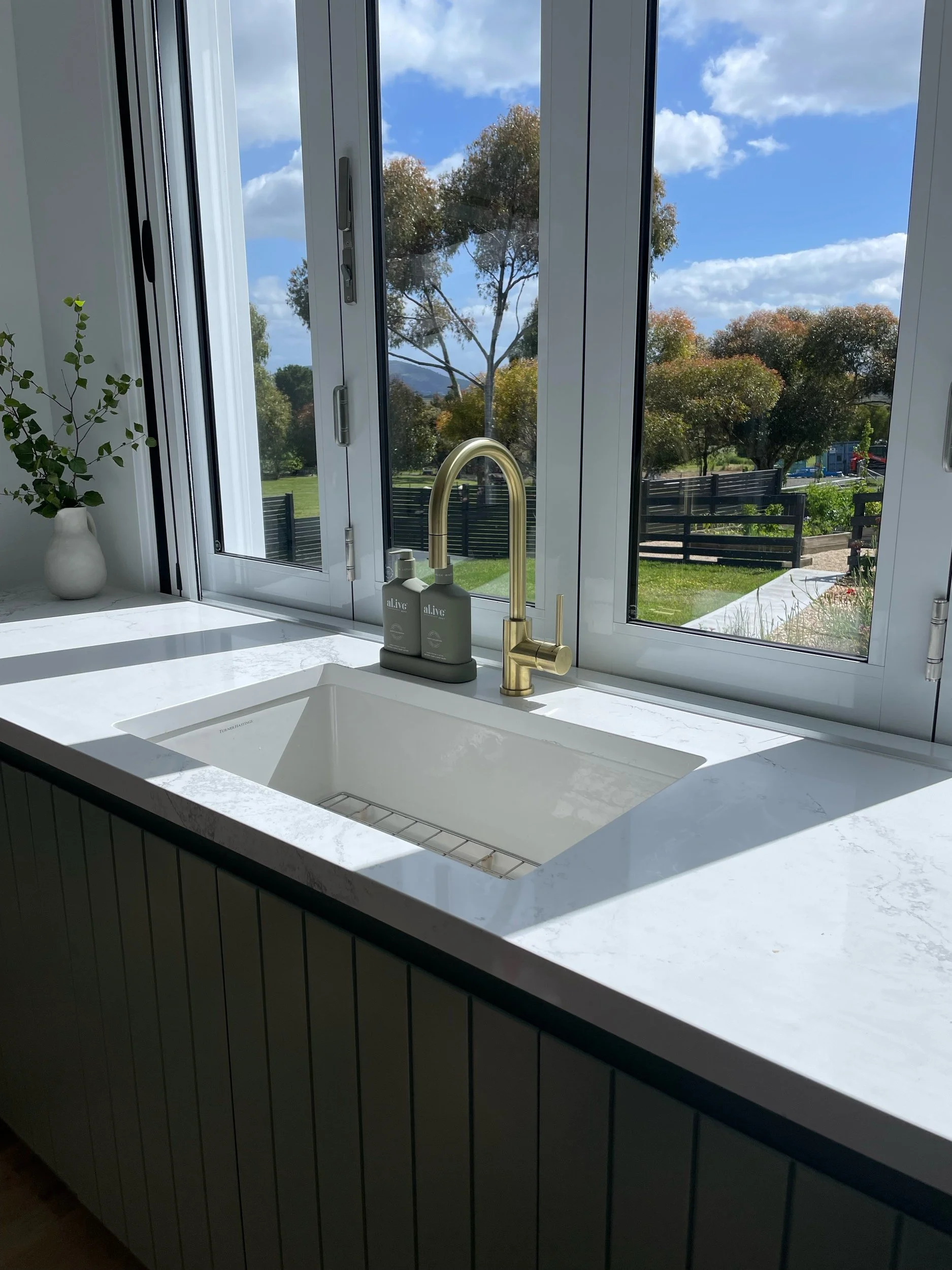 Saxon Kitchen

Cabinetry - VJ profile
Laminex Bayleaf
Tap - ABI Interiors
Sink - Turner and Hastings NOVI
Stone - Caeserstone Empire white