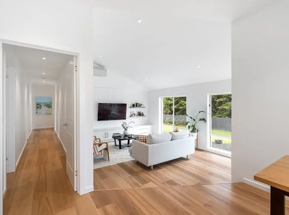 Saxon Lounge

Wall cladding - Laminex Surround
Paint - Vivid white
Cabinetry - Flat panel - 2PAC vivid white
Handles - Lo and Co
Floor - Karndean Korlock 'warm ash'
Rug - Miss Amara
Shelves - South Oak woodcraft