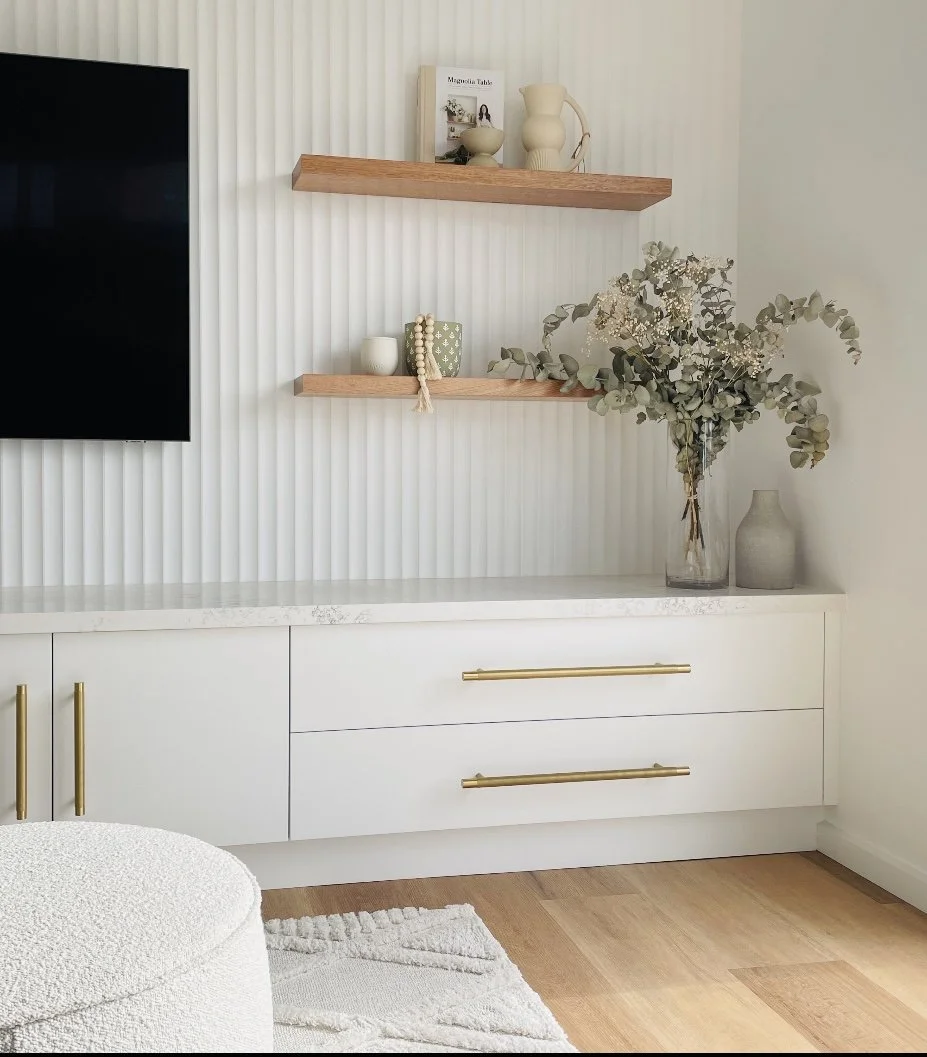 Saxon Lounge

Wall cladding - Laminex Surround
Paint - Vivid white
Cabinetry - Flat panel - 2PAC vivid white
Handles - Lo and Co
Floor - Karndean Korlock 'warm ash'
Rug - Miss Amara
Shelves - South Oak woodcraft