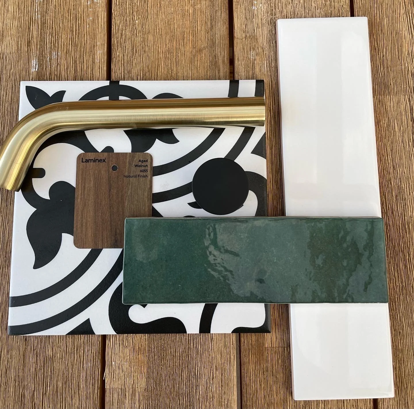 Axiom Bathroom Moodboard

Green Tiles - National Tiles Poloma Gloss
Black and White - Rossetto Tiles 
Mirror - RJ Living 
Sink - Nood Co
Tapware - ABI Interiors
Bath - Reece Kado Pettit 
Vanity - Laminex Walnut made to measure
Stone Bench - Silestone
