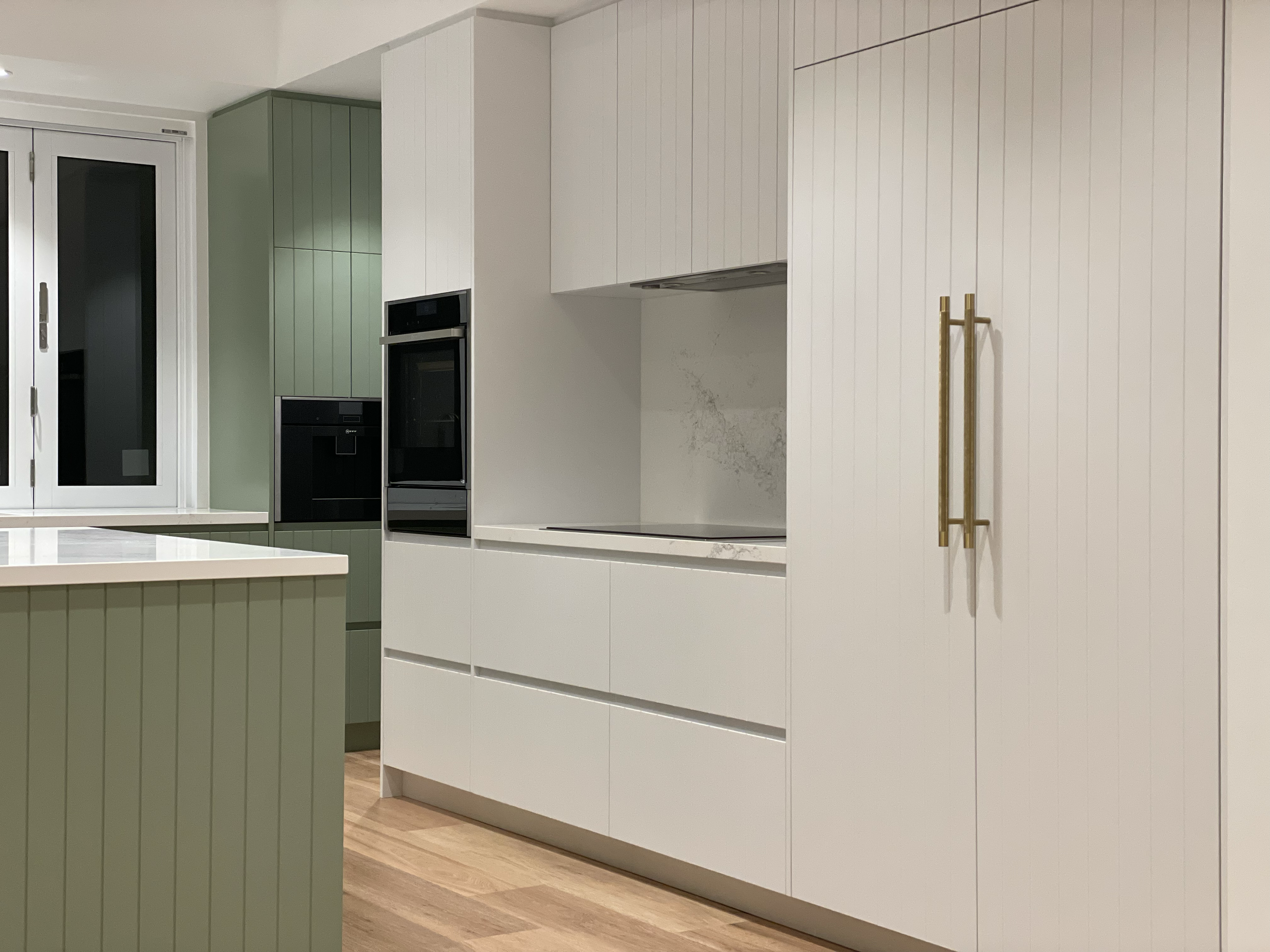 Saxon Kitchen

Profile - VJ 
Colour - 2PAC colour matched Laminex Bayleaf
Handles - Lo and Co
Appliances - NEFF
Stacker windows - Stegbar