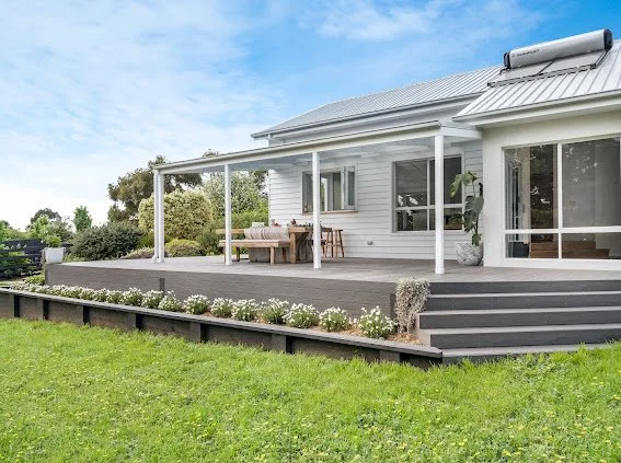 Saxon Project.

Exterior colours 
Dulux Lexicon 1/4 Linea Boards
Colourbond Shale grey roof.
Dulux Viivid white trim.  
Decking - Eco deck