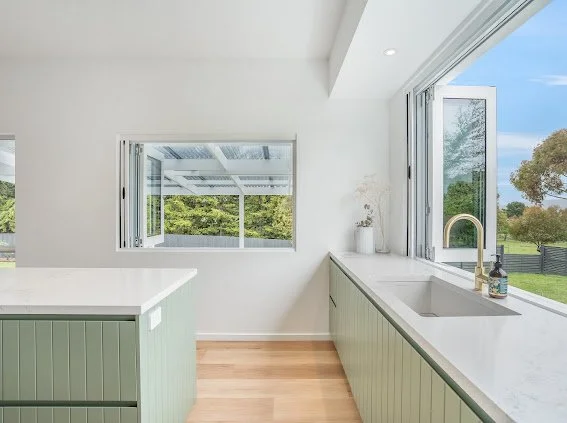 Saxon Kitchen

Cabinetry - VJ profile
Laminex Bayleaf
Tap - ABI Interiors
Stone - Caeserstone Empire white