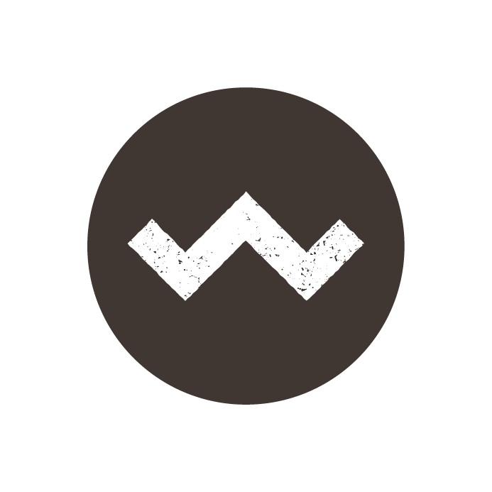 Logo with a black circle and white text reading "Western Cape" and "Fuelling the Adventure" surrounding a black zigzag line in the centre.
