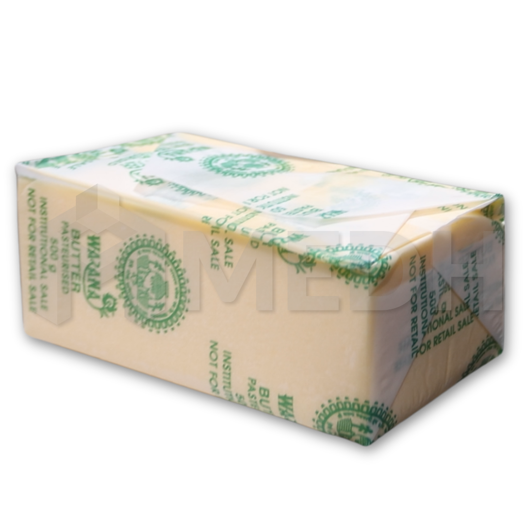 Wrapped butter block in parchment paper by MEDH's Flex 1000 Butter Wrapping Machine