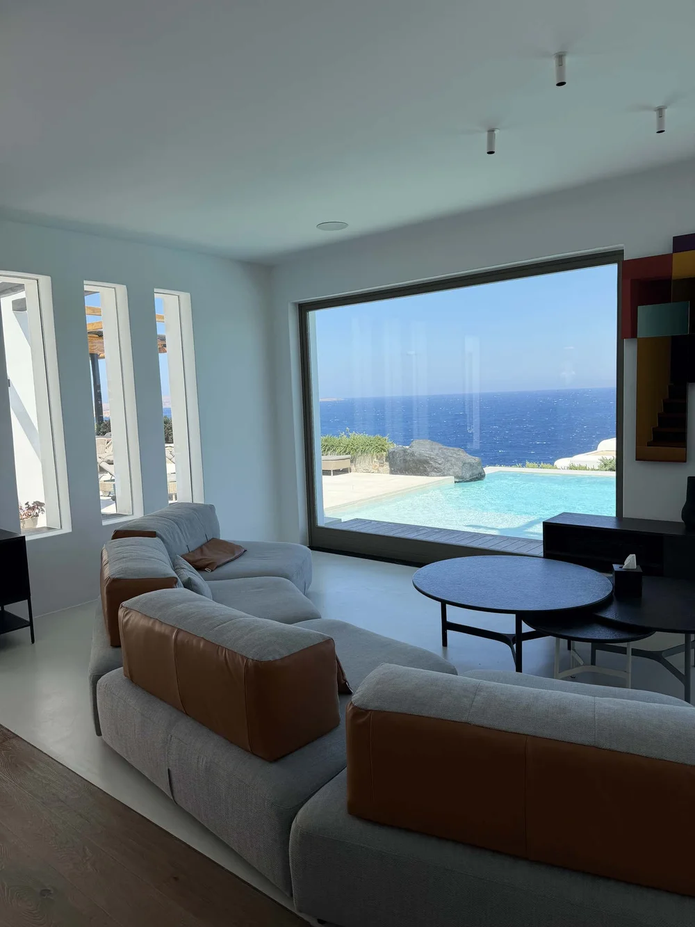 Private villa in Mykonos: sea-view living room, a stay arranged by Orion Sirr
