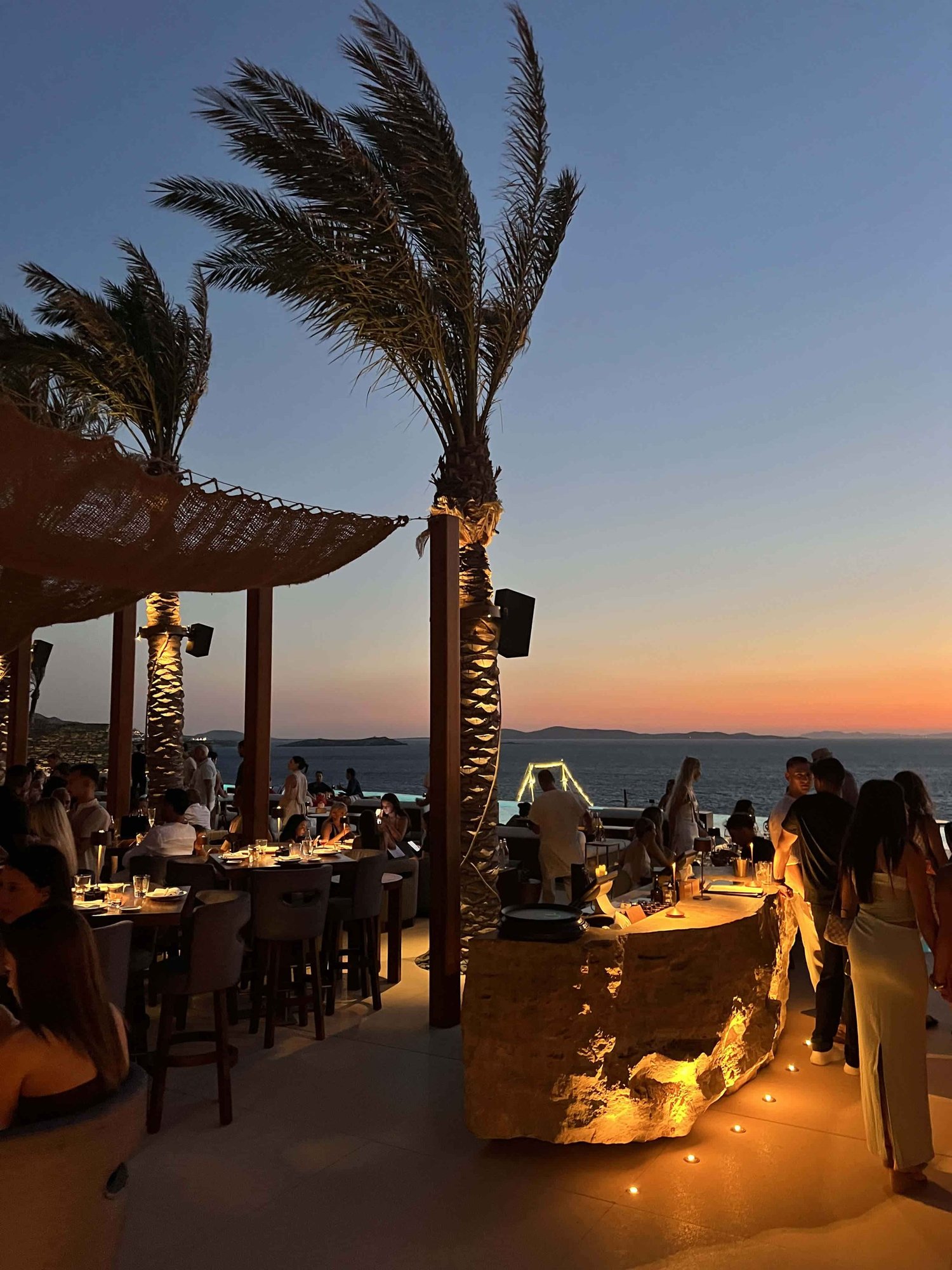 Mykonos wedding weekend welcome dinner by the sea, held privately by Orion Sirr