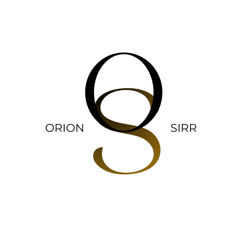 A person in a wheelchair using a laptop at a desk.